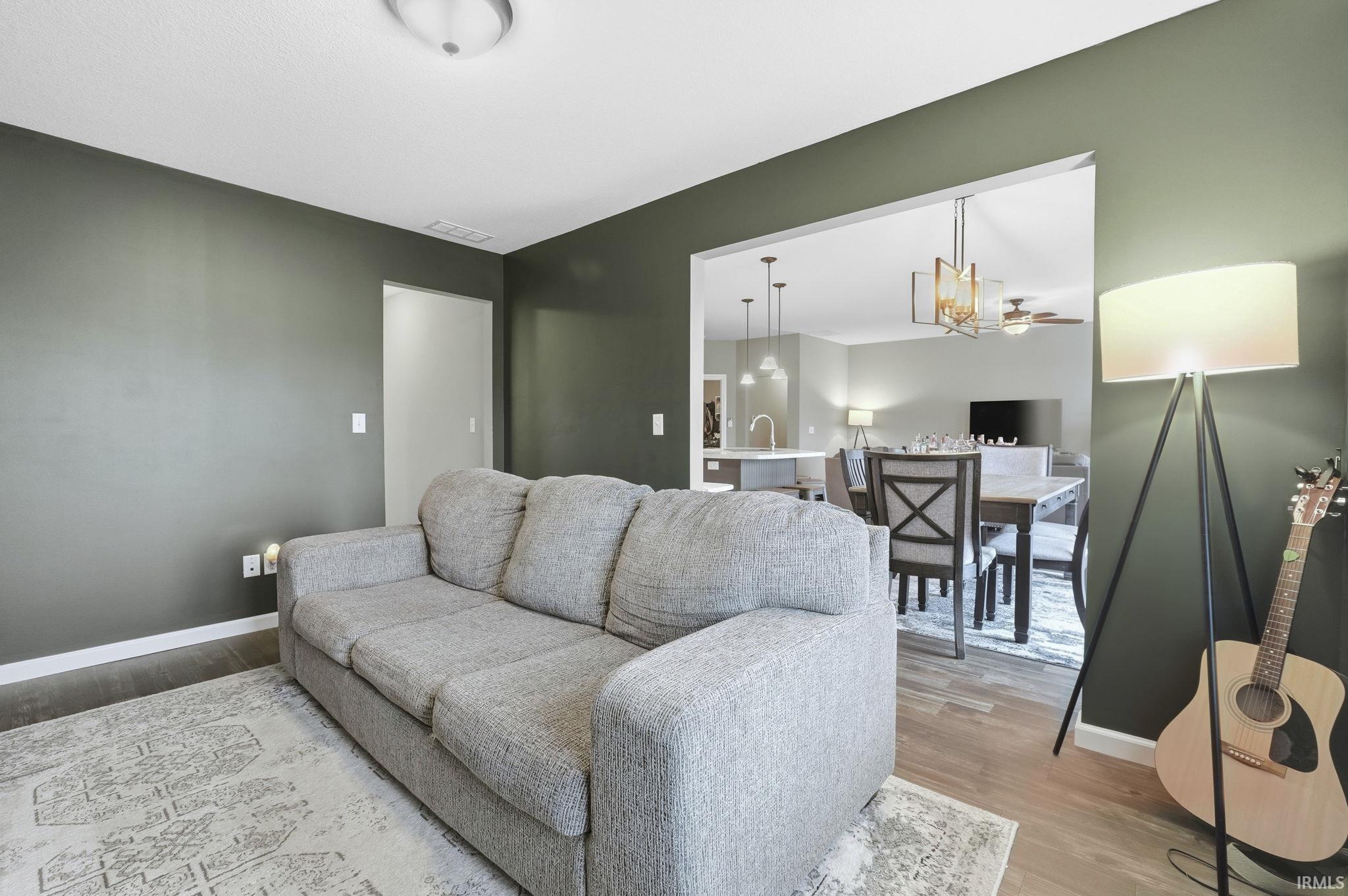 Living room with light wood-style floors and baseboards