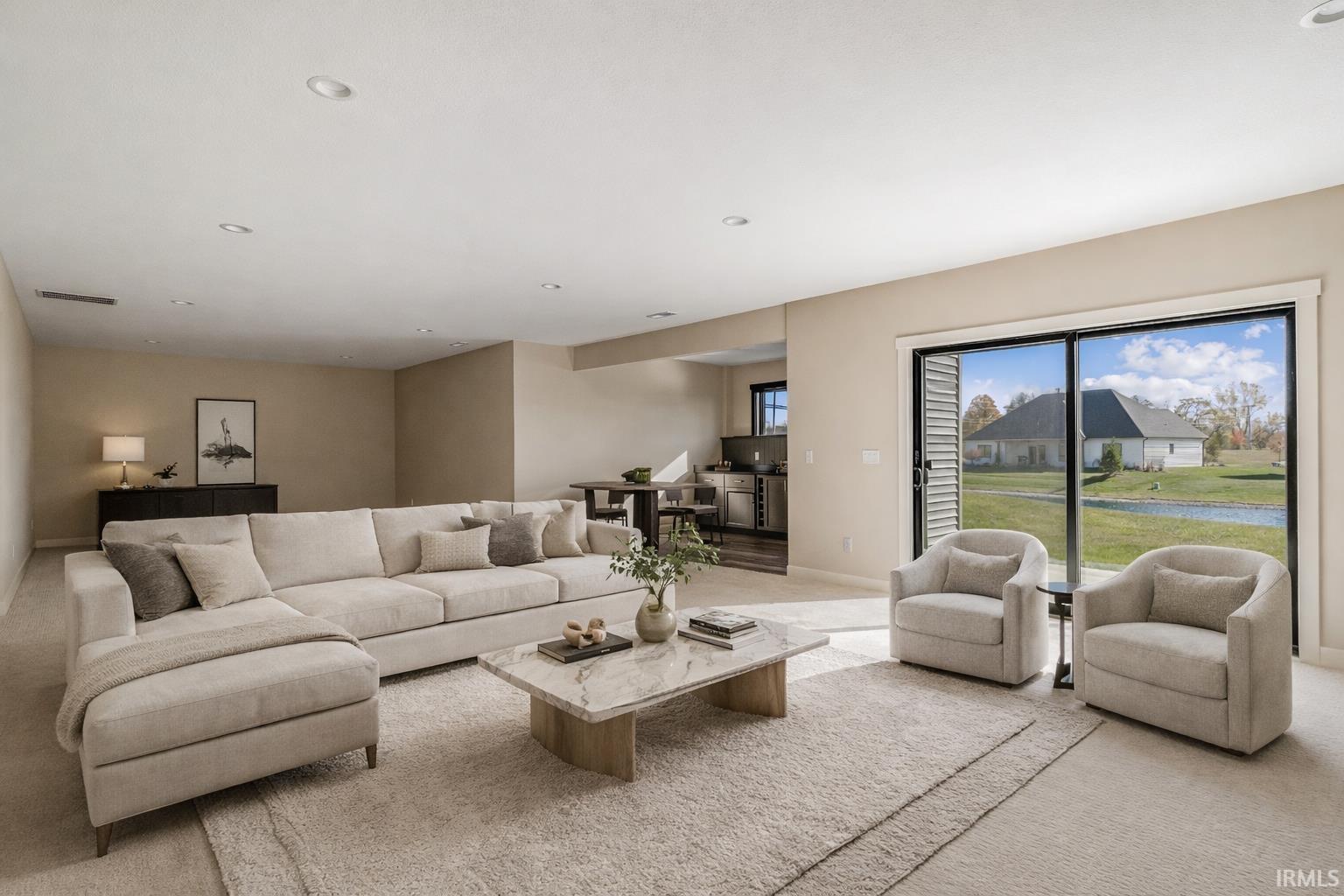 Living room featuring light carpet and recessed lighting