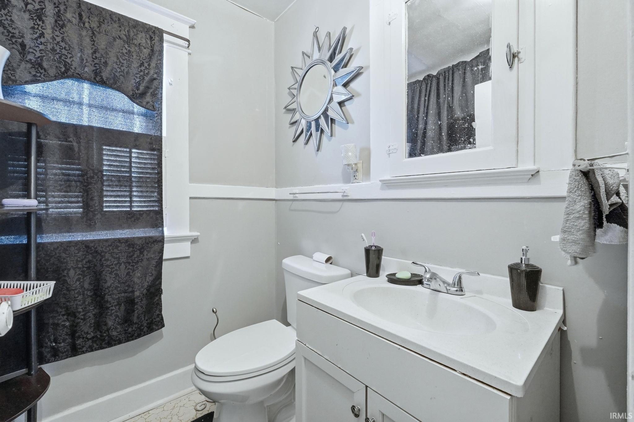 Bathroom with vanity and toilet