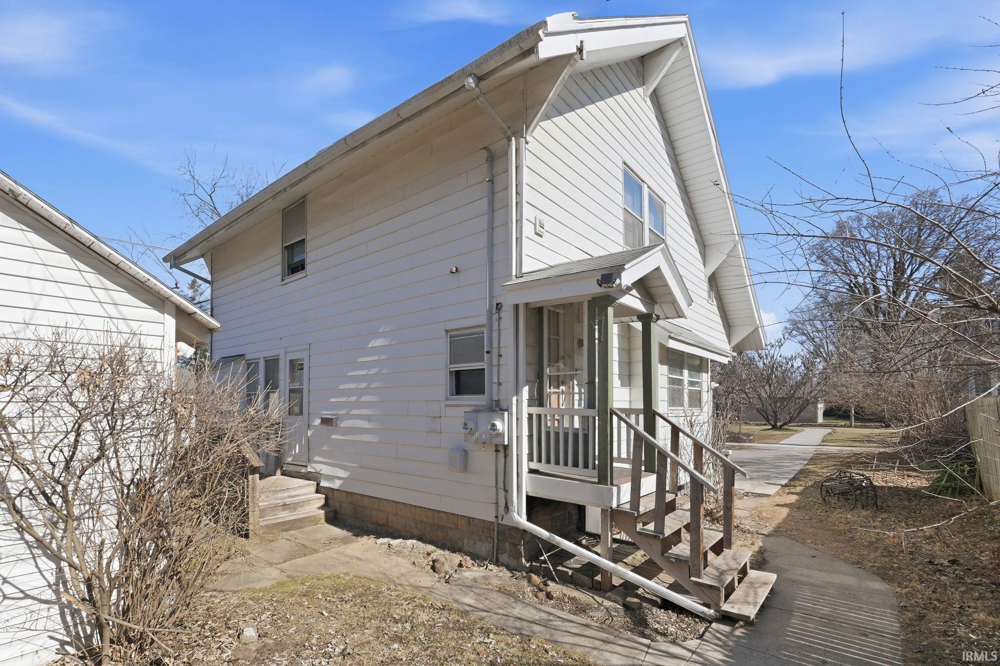 Back of house featuring entry steps