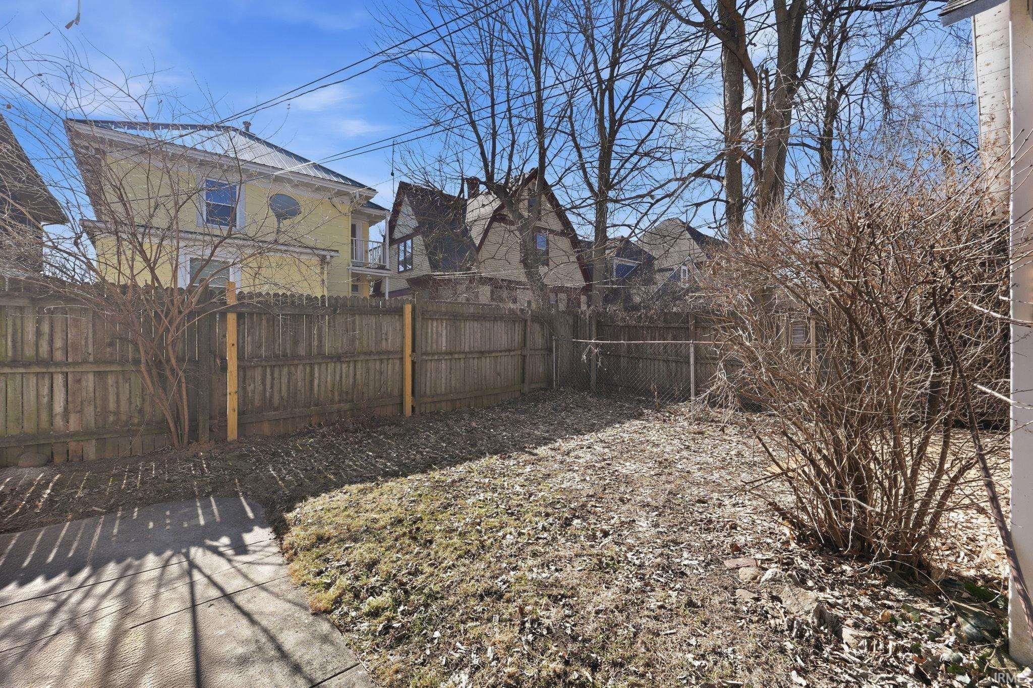 View of fenced backyard