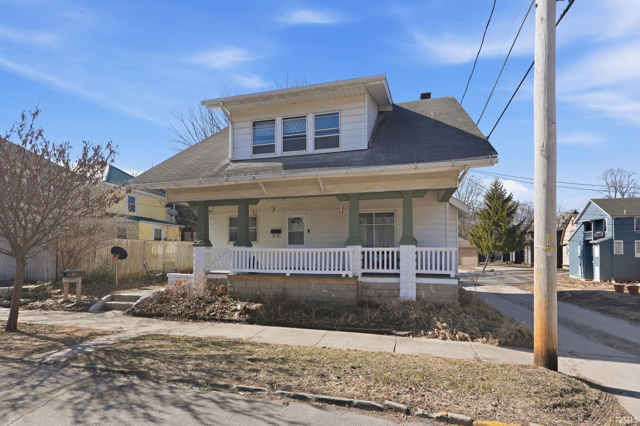 Bungalow-style house with a porch and roof with shingles