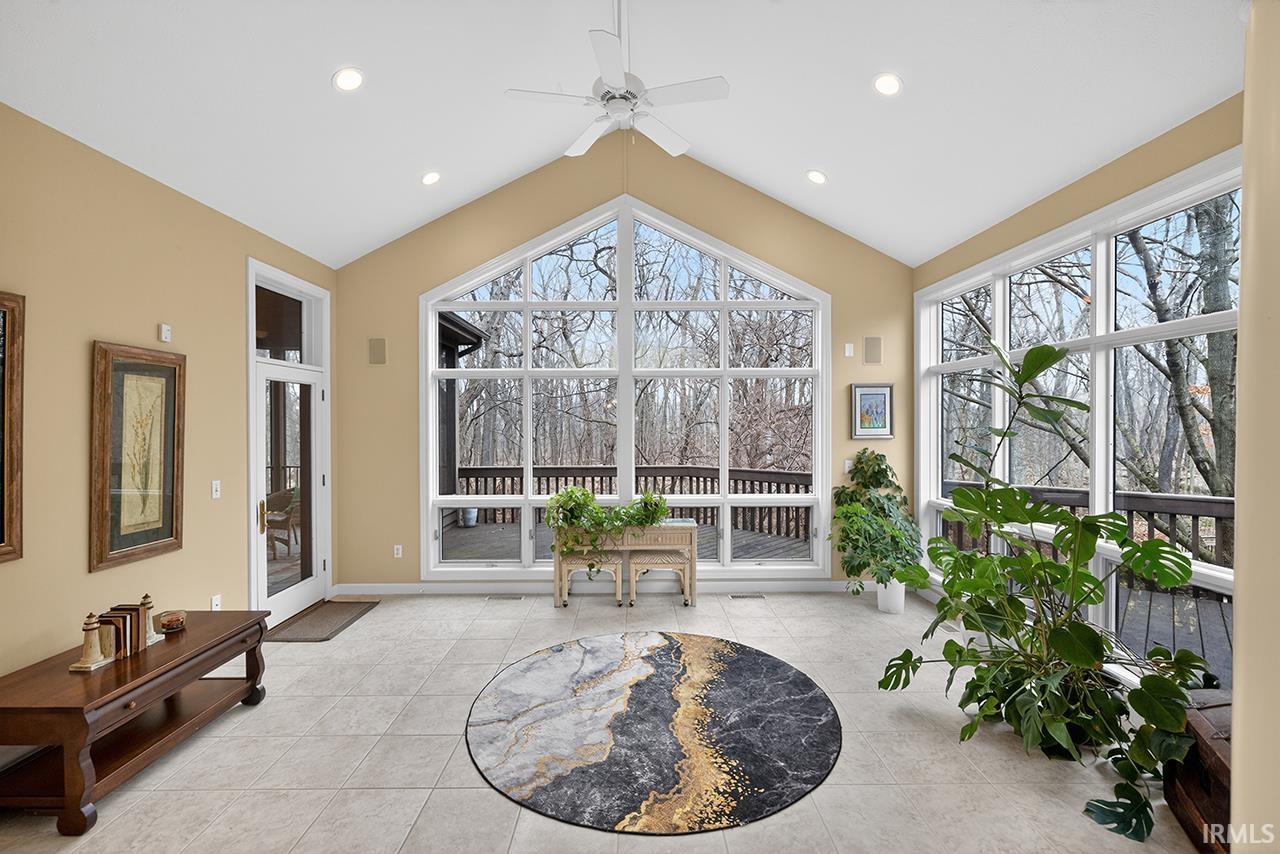 Sunroom featuring plenty of natural light and recessed lighting