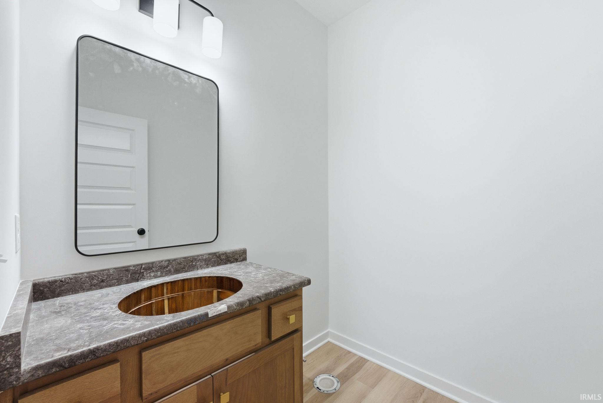 Bathroom featuring vanity and light wood-style flooring