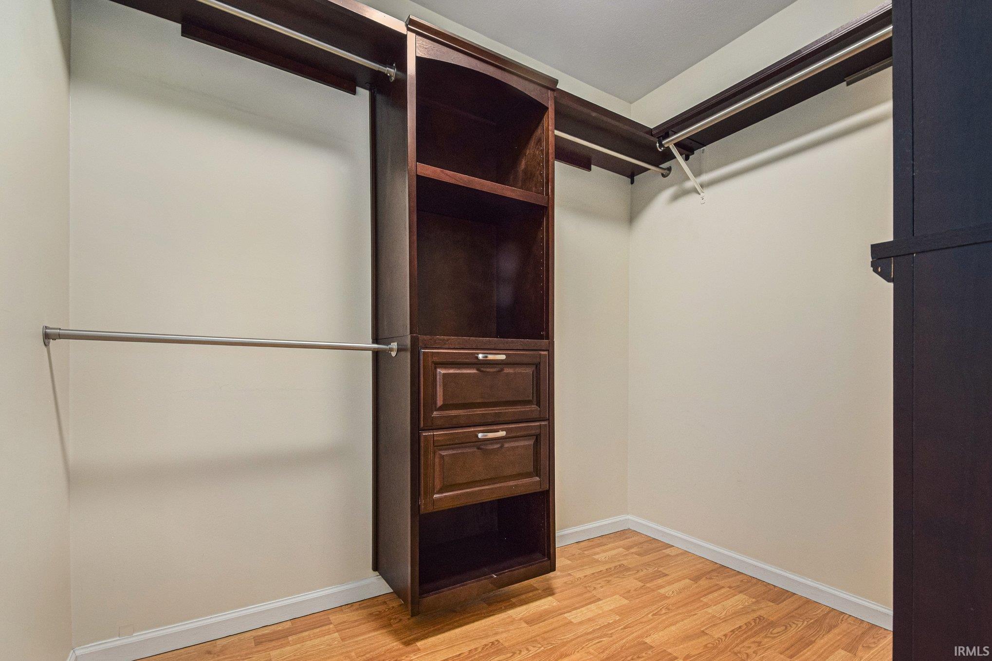 Walk in closet featuring light wood-style floors