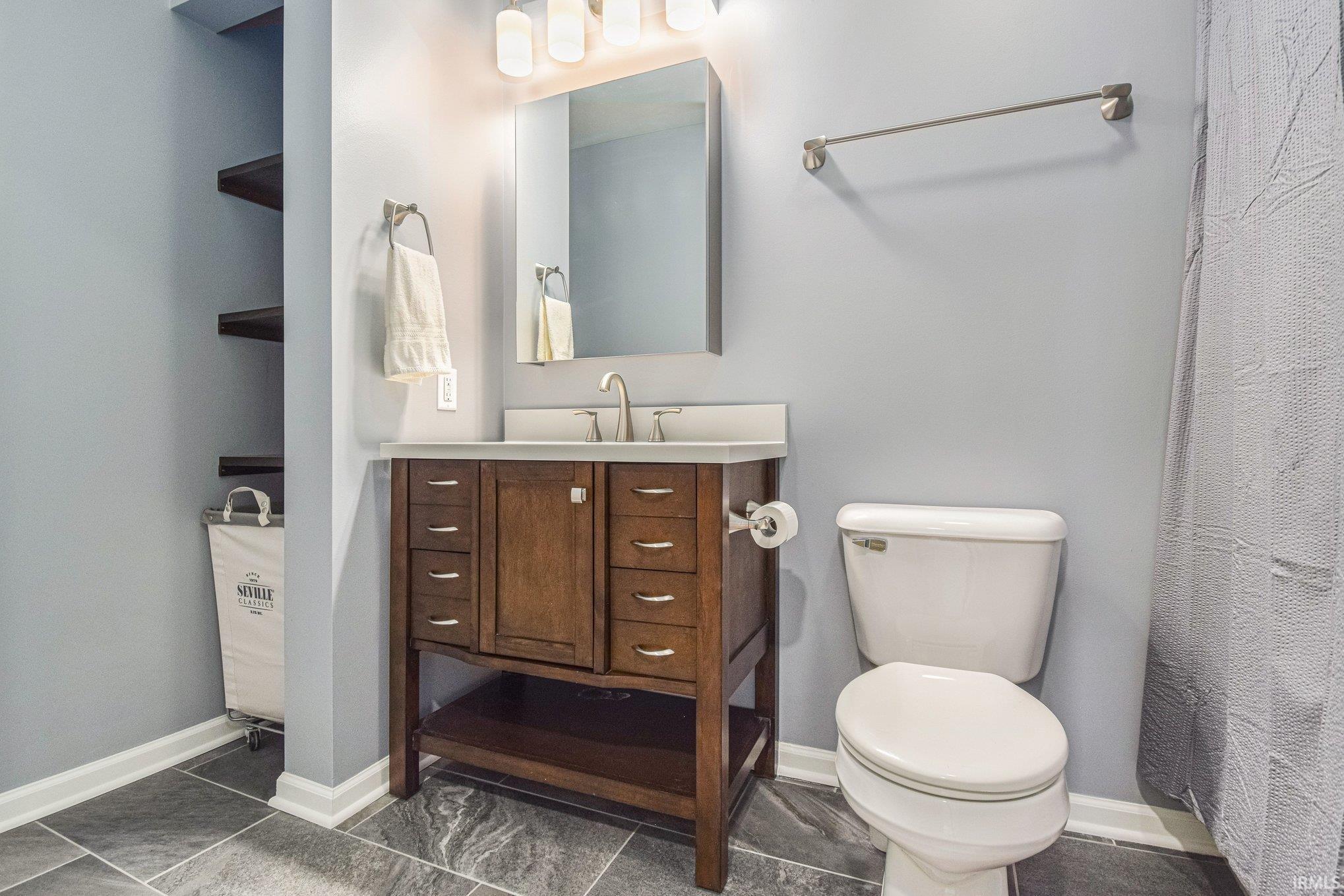 Bathroom with vanity and a shower with curtain