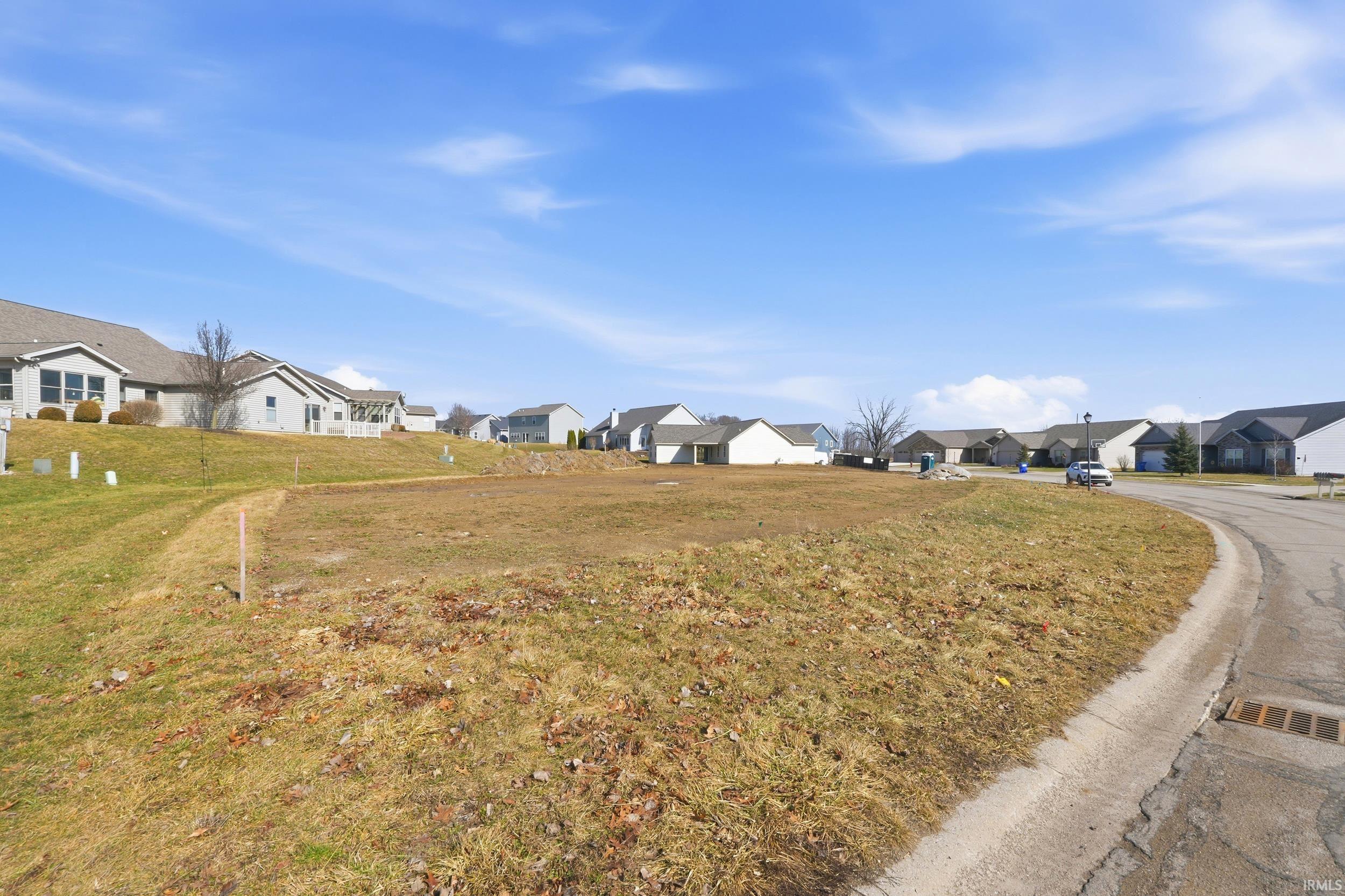 View of asphalt street with a residential view