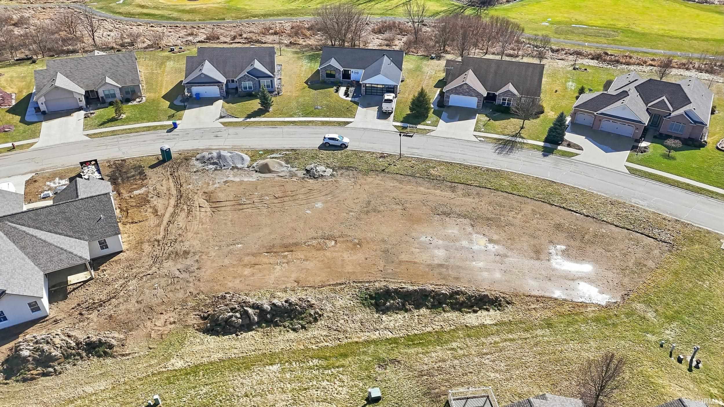 Aerial perspective of suburban area with a local golf course