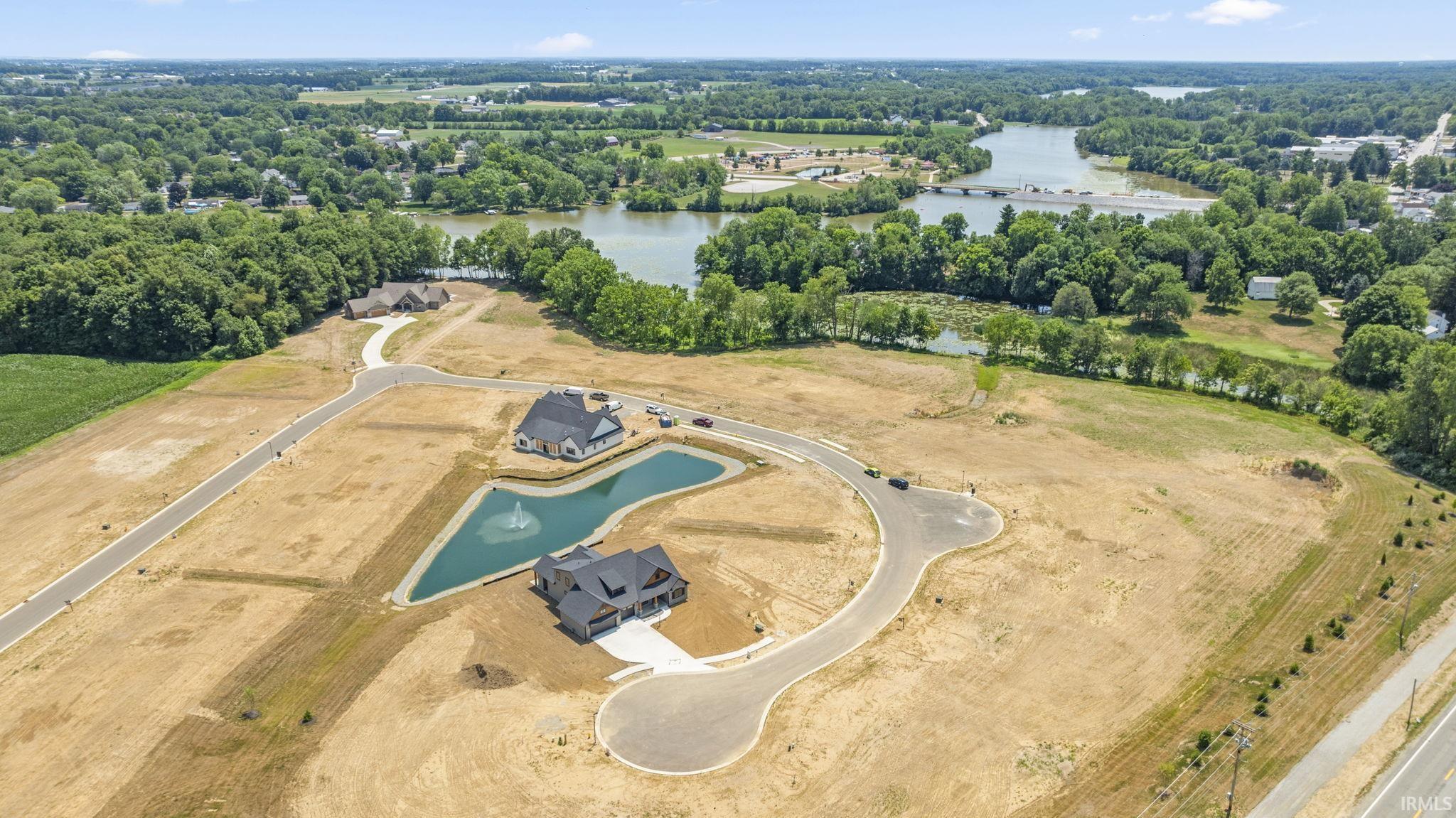 Aerial overview of property's location featuring a large body of water