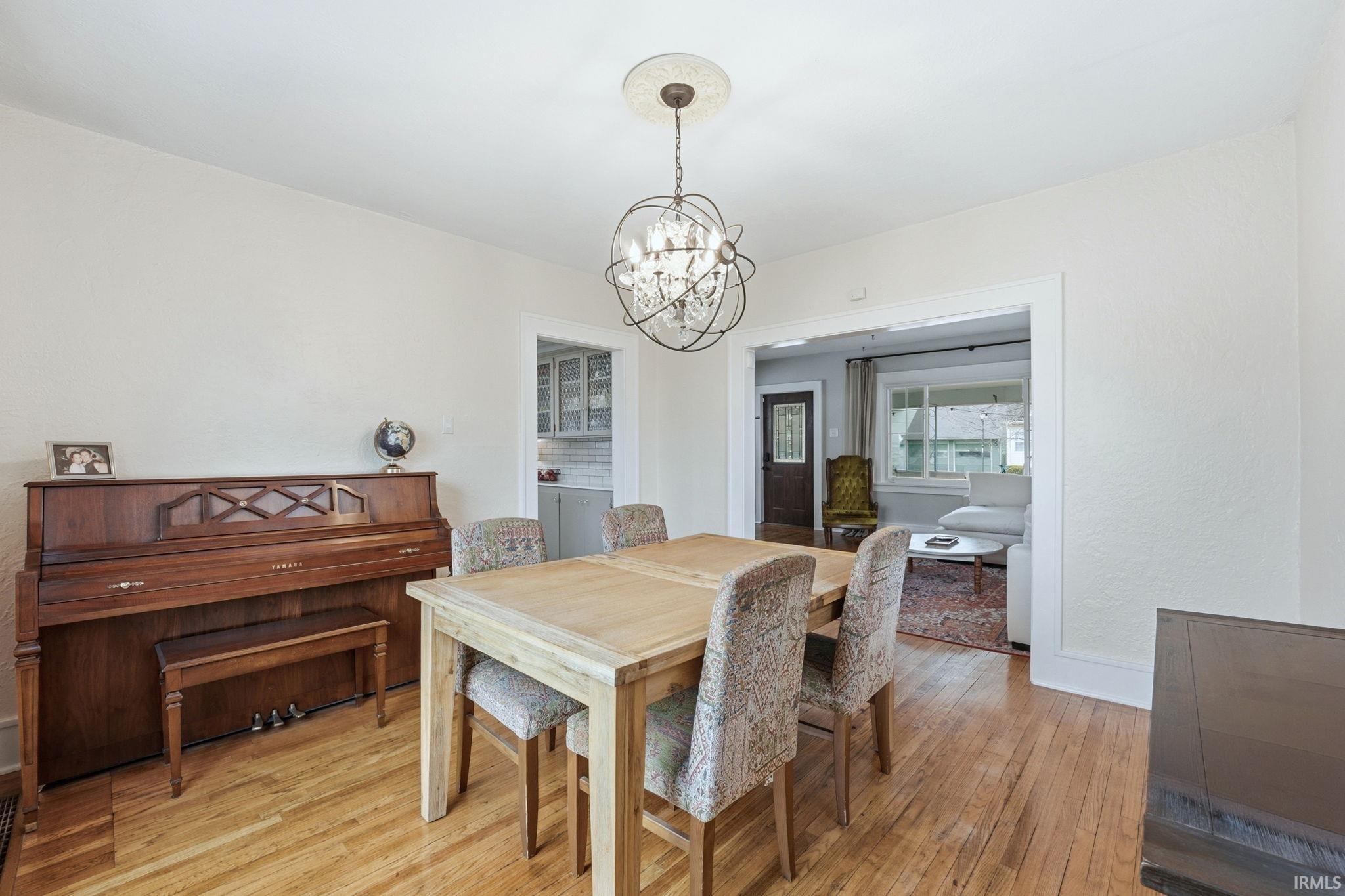 Dining room featuring hanging lights and light wood-type flooring