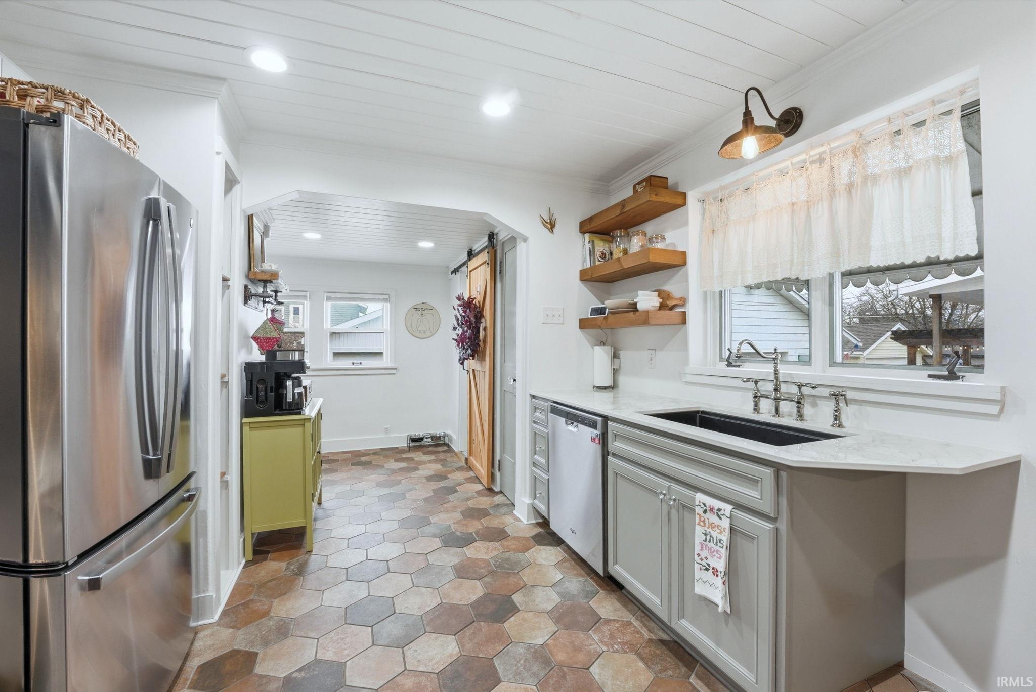 Kitchen featuring stainless steel appliances, light stone countertops, open shelves, wood ceiling, and recessed lighting