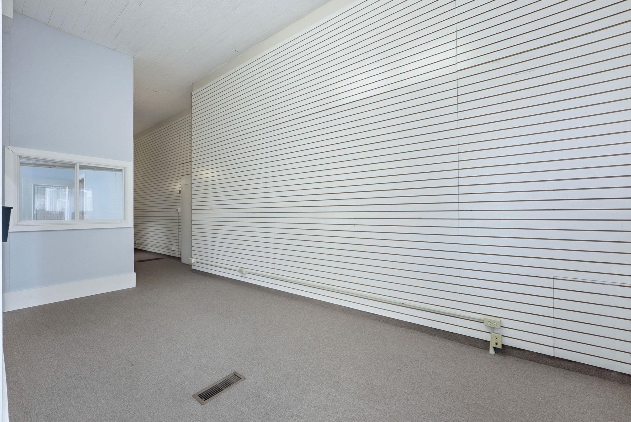 Unfurnished living room featuring carpet floors