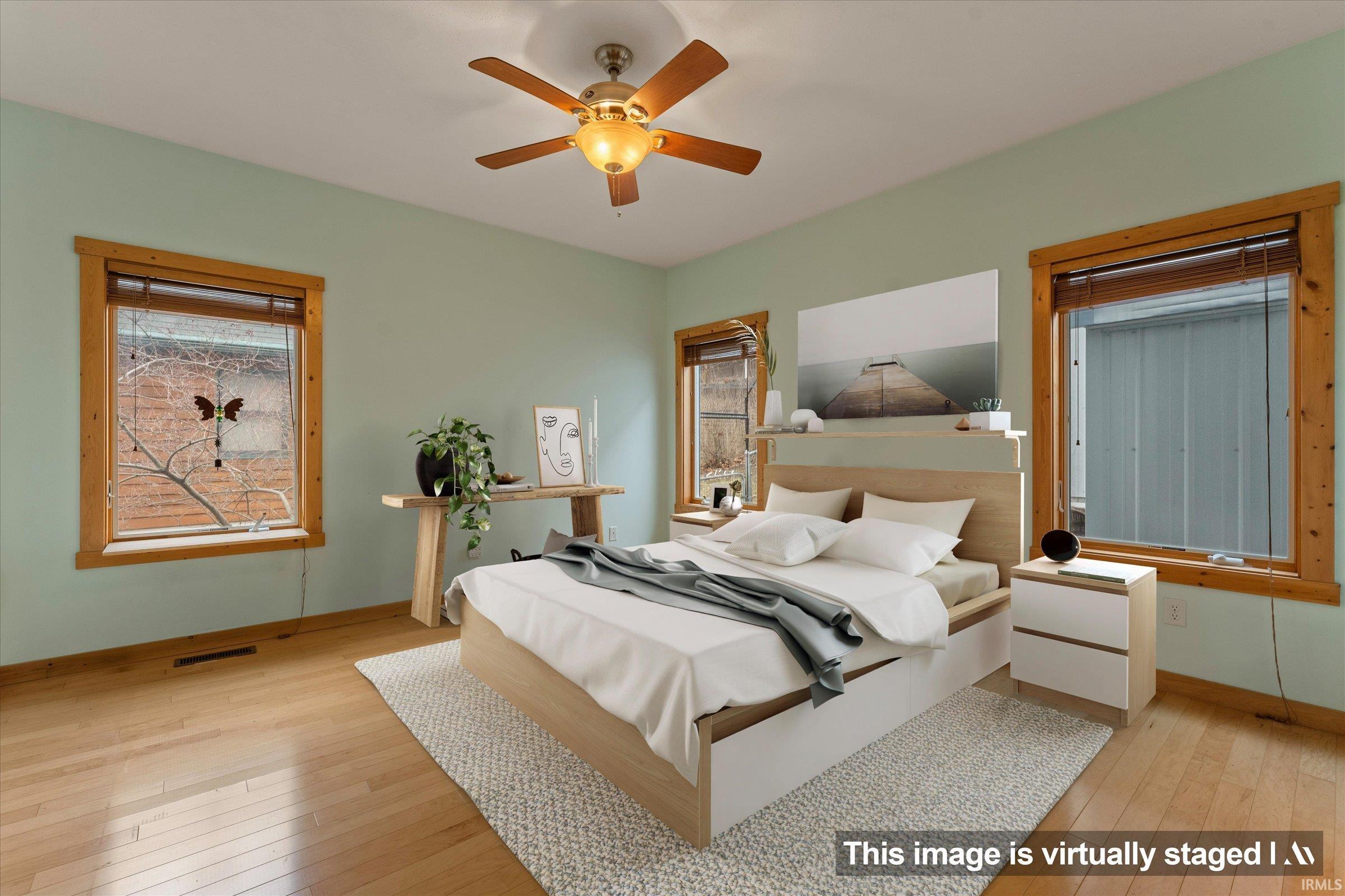 Bedroom featuring light wood finished floors and ceiling fan