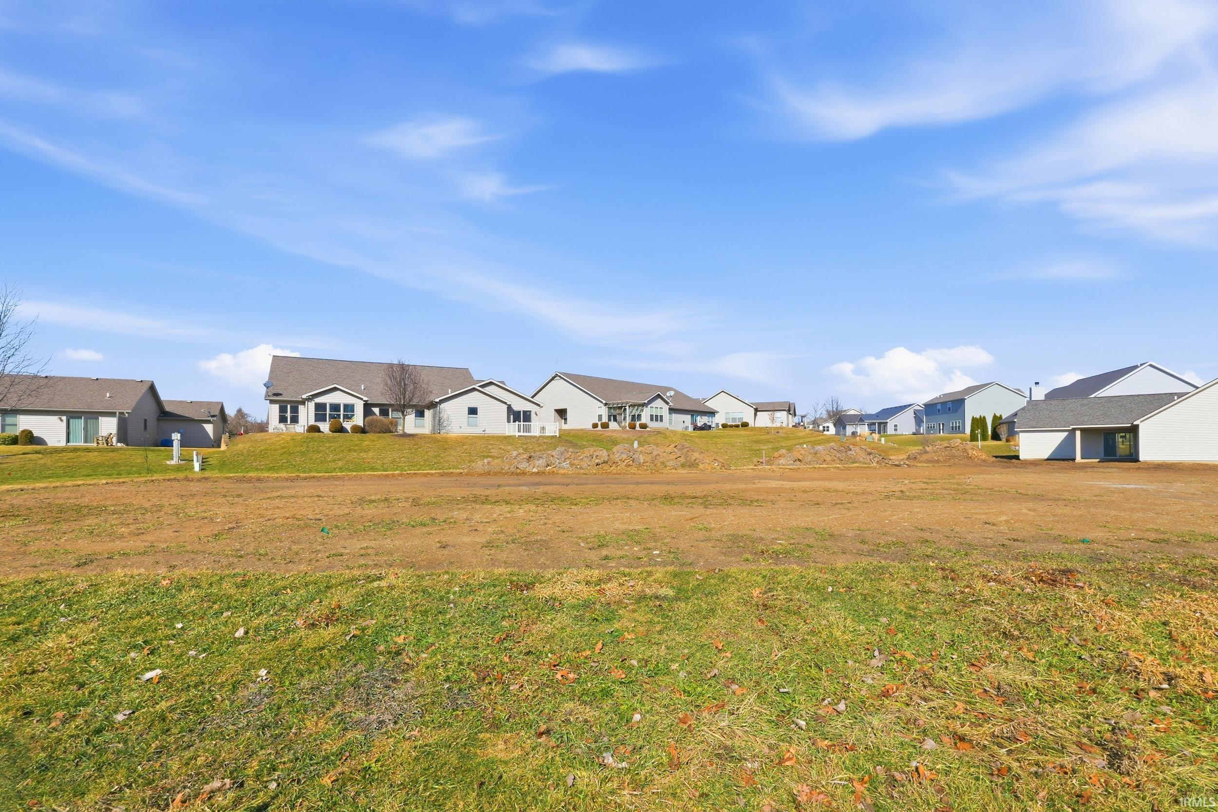 View of grassy yard with a residential view