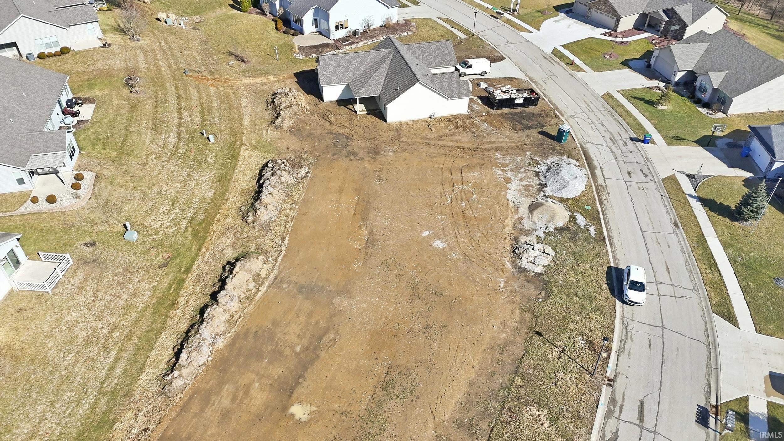 View of property location with nearby suburban area