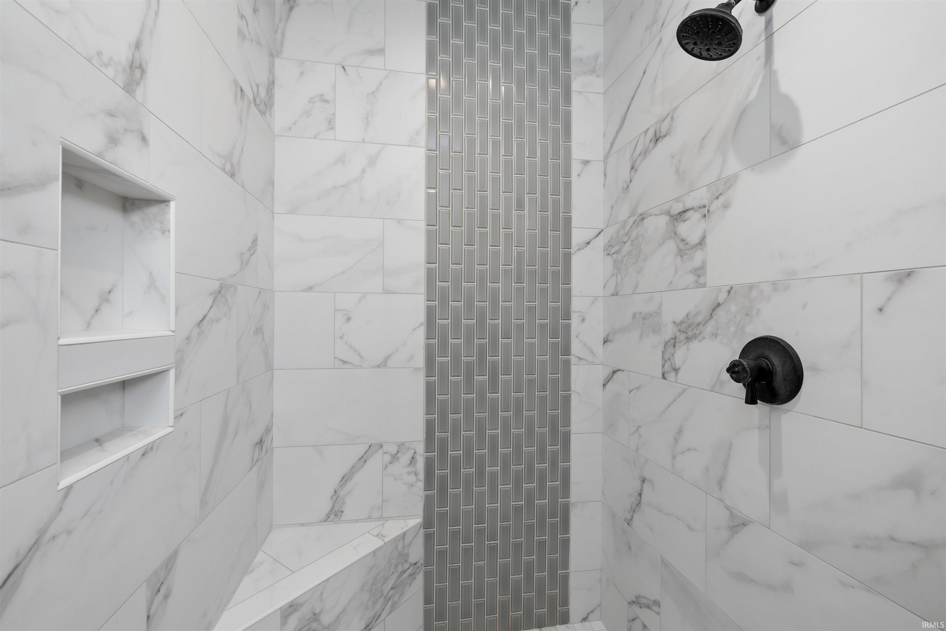 Full bathroom featuring tiled shower