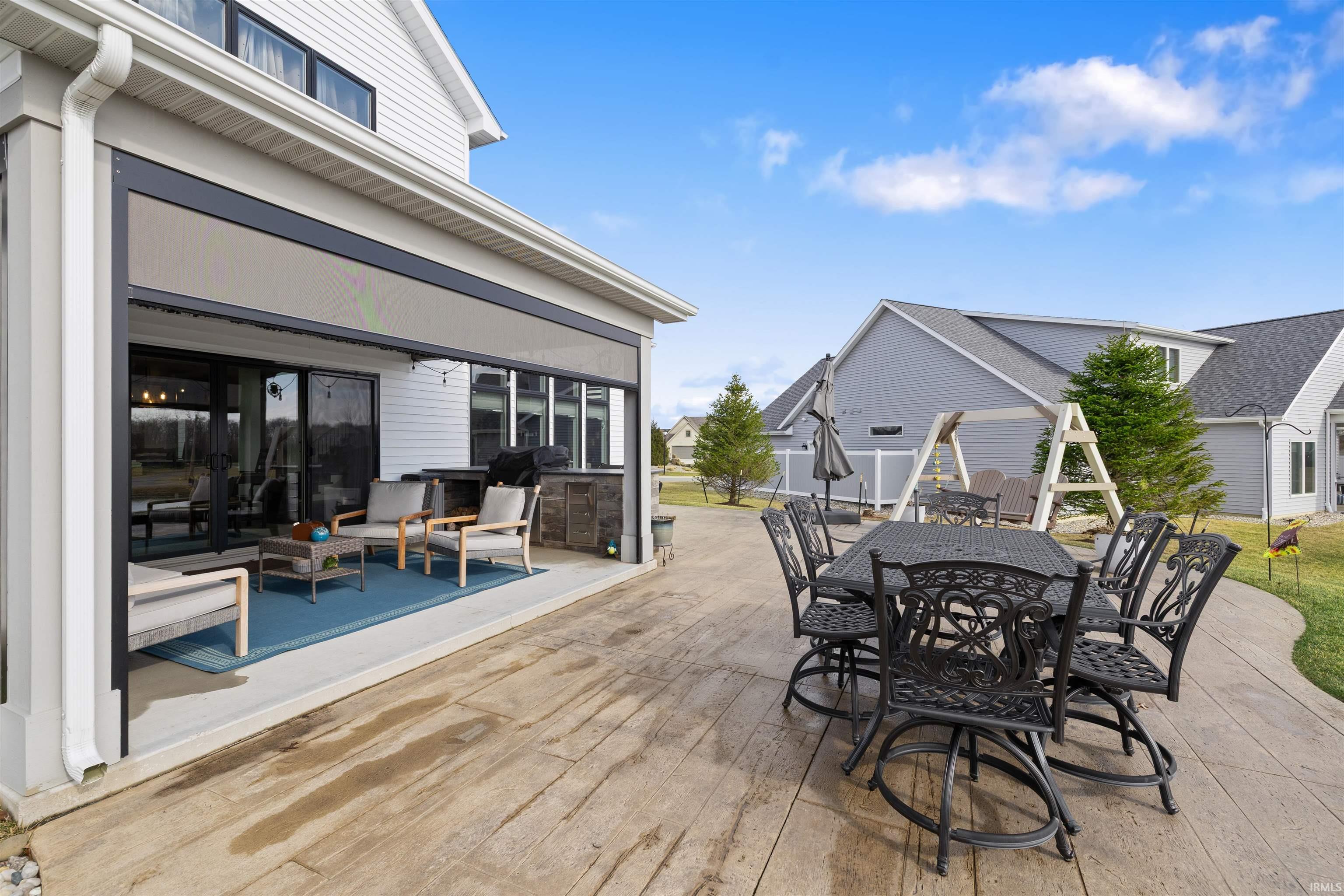 Wooden deck with outdoor dining space, a residential view, a patio area, and area for grilling