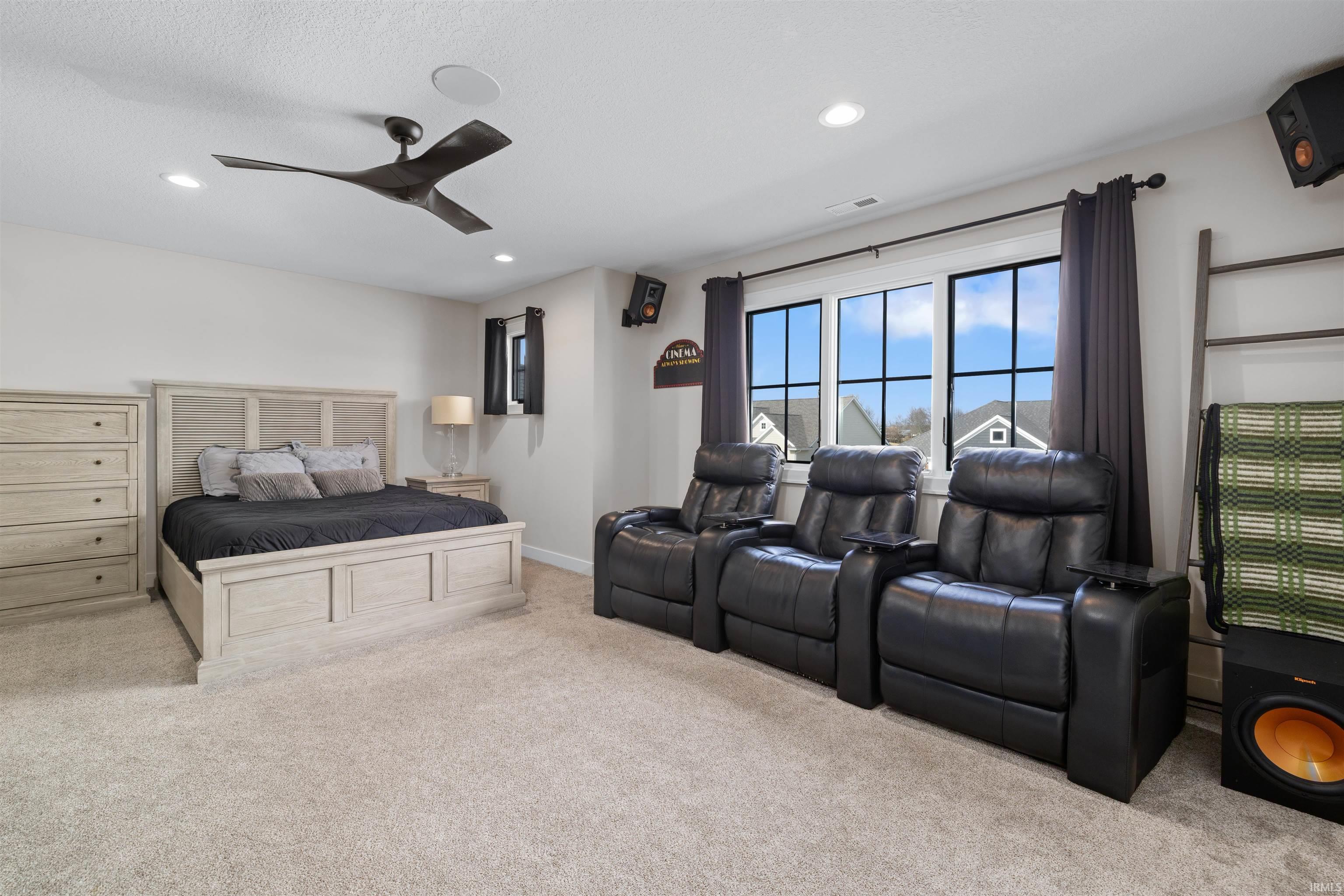 featuring light colored carpet, ceiling fan, and recessed lighting