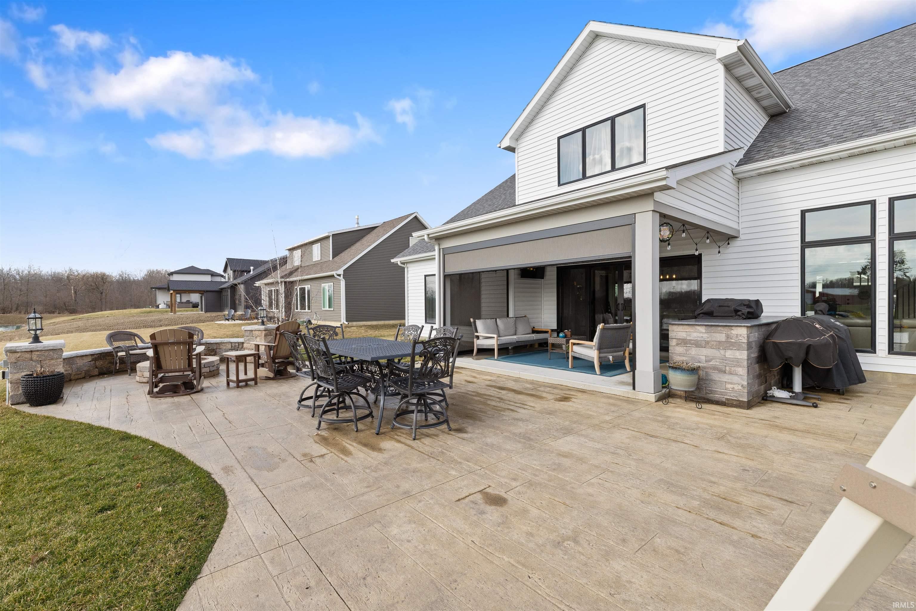 View of patio / terrace featuring outdoor lounge area, grilling area, and an outdoor fire pit