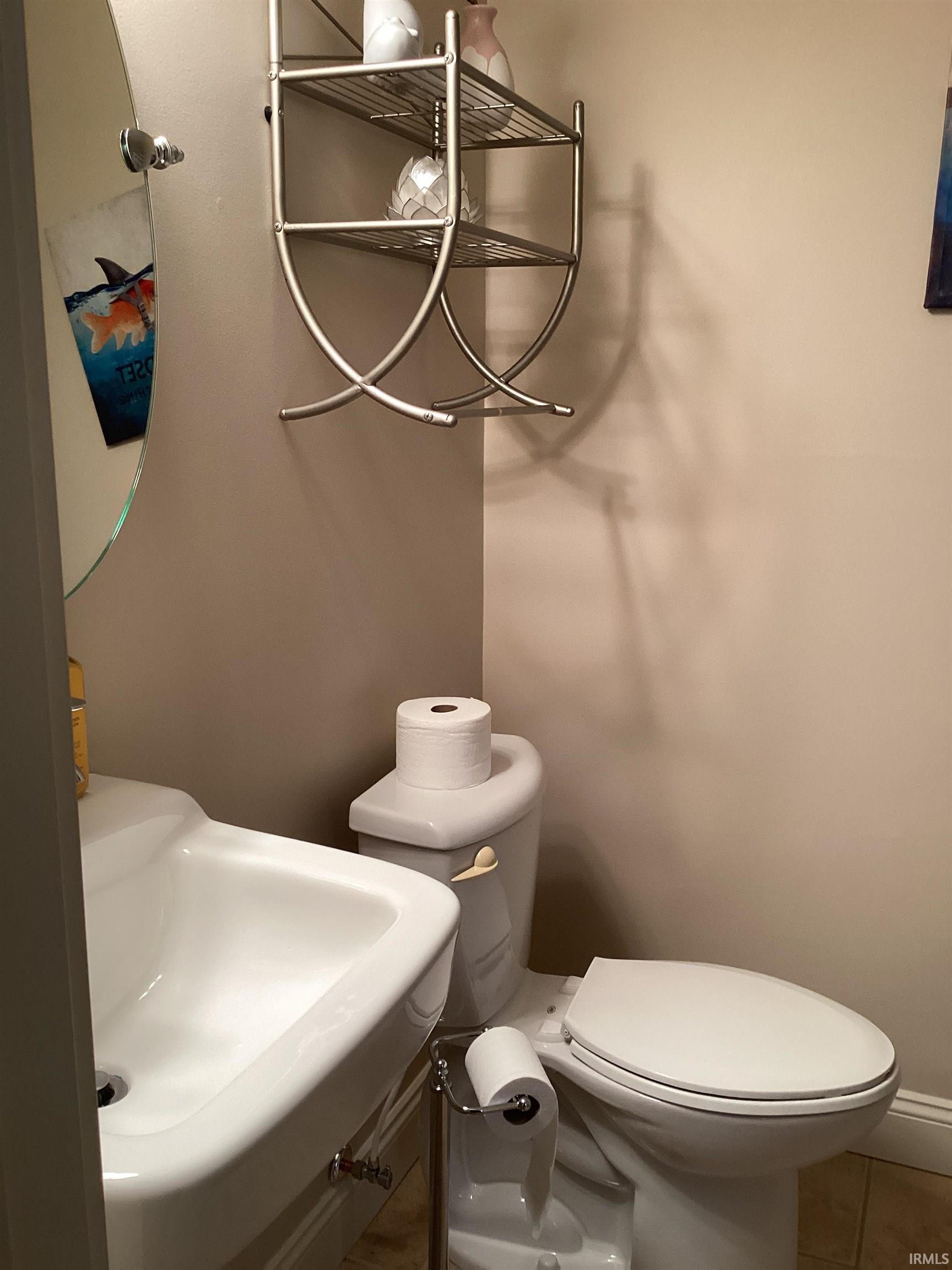 Bathroom featuring tile patterned floors and vanity