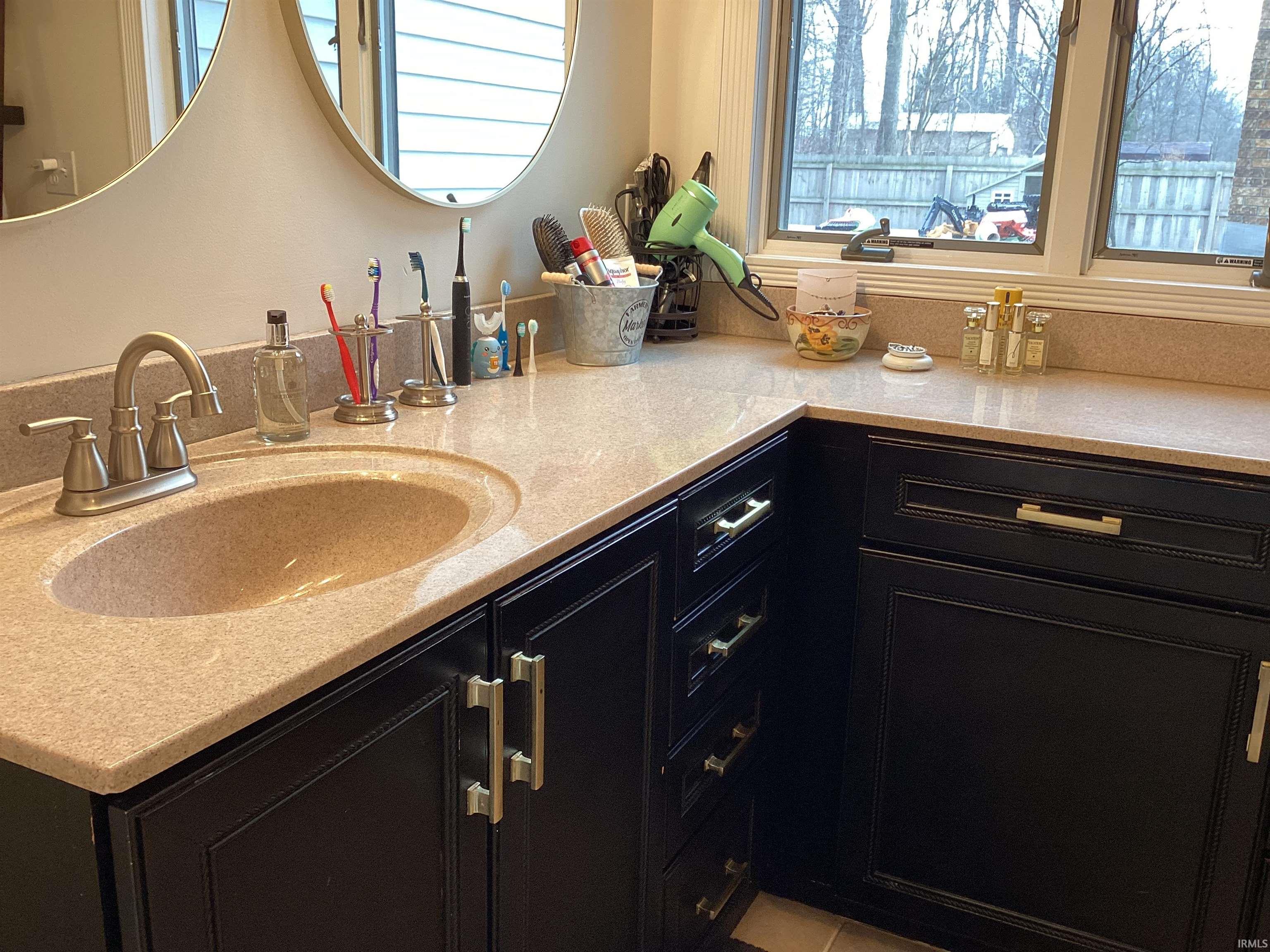 Bathroom with vanity and healthy amount of natural light