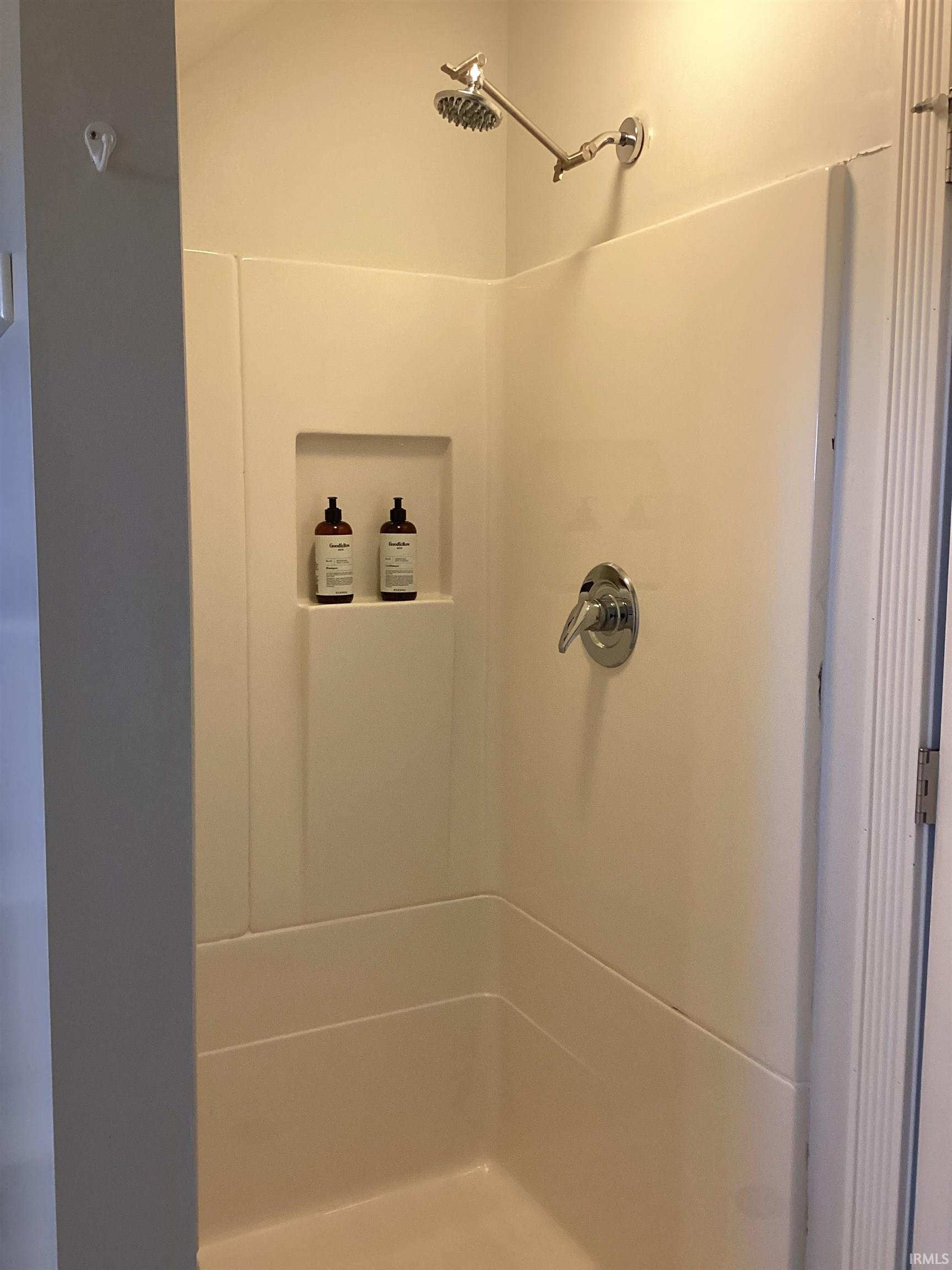 Full bathroom featuring a stall shower