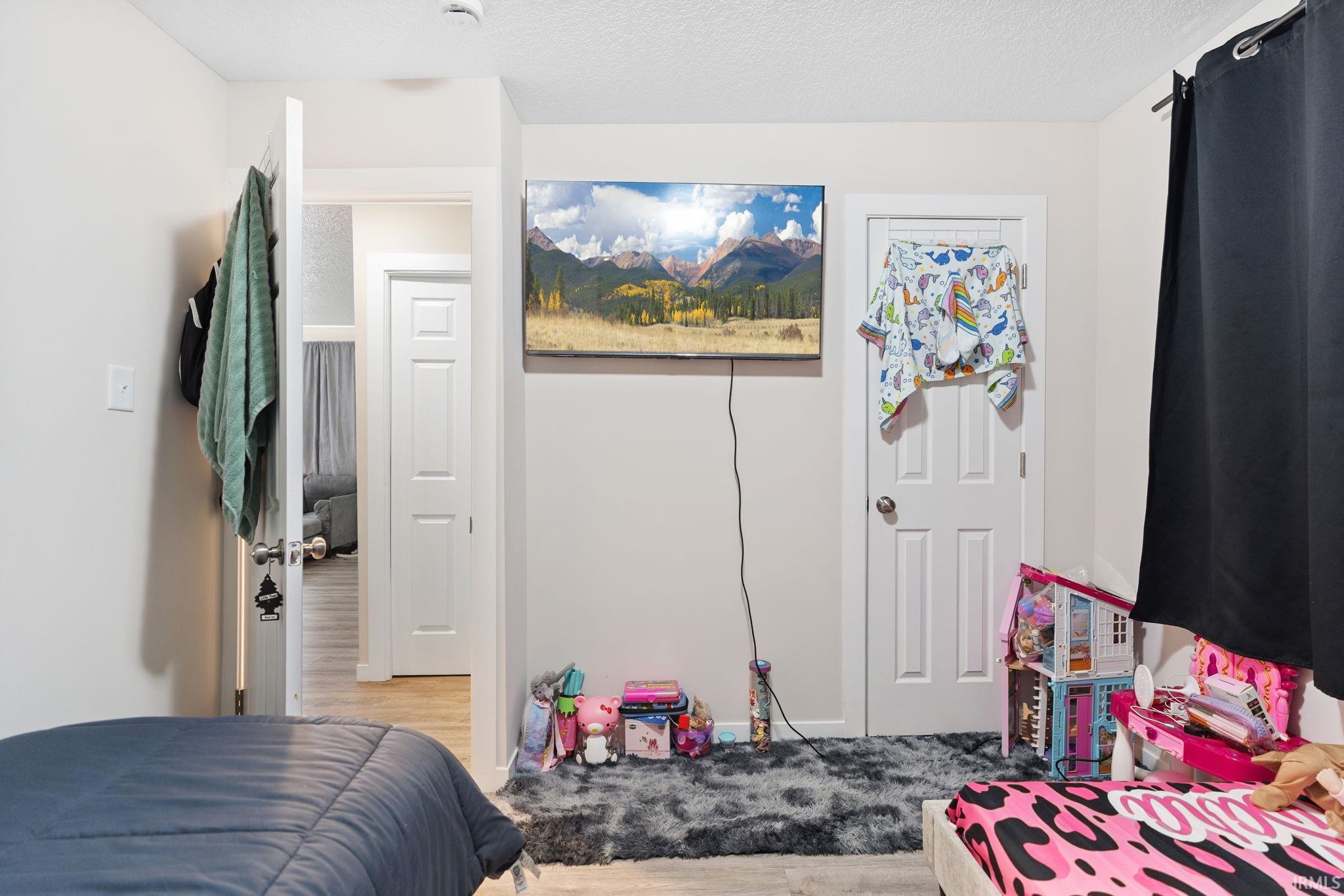 Bedroom featuring a textured ceiling