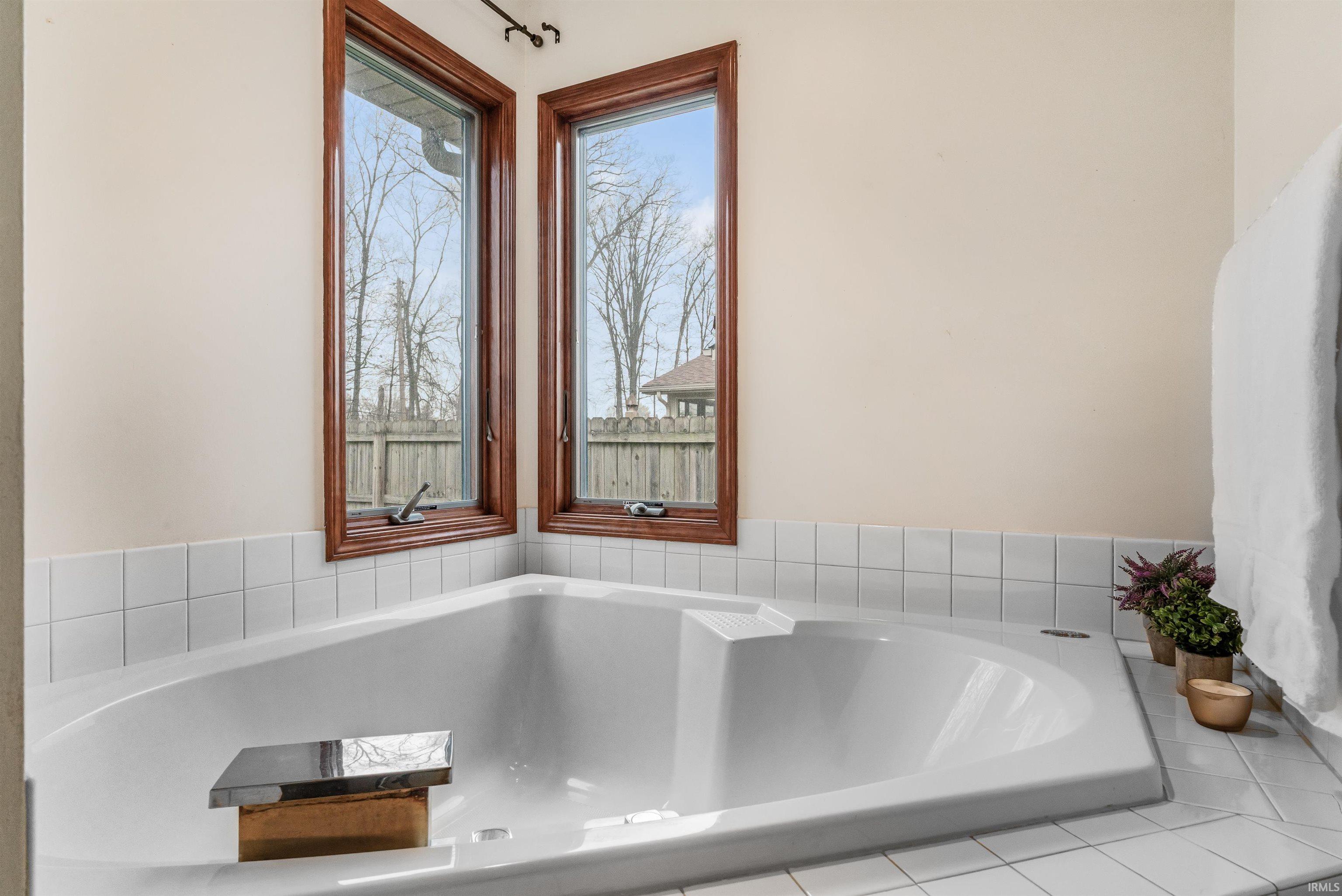 Full bathroom with a bath