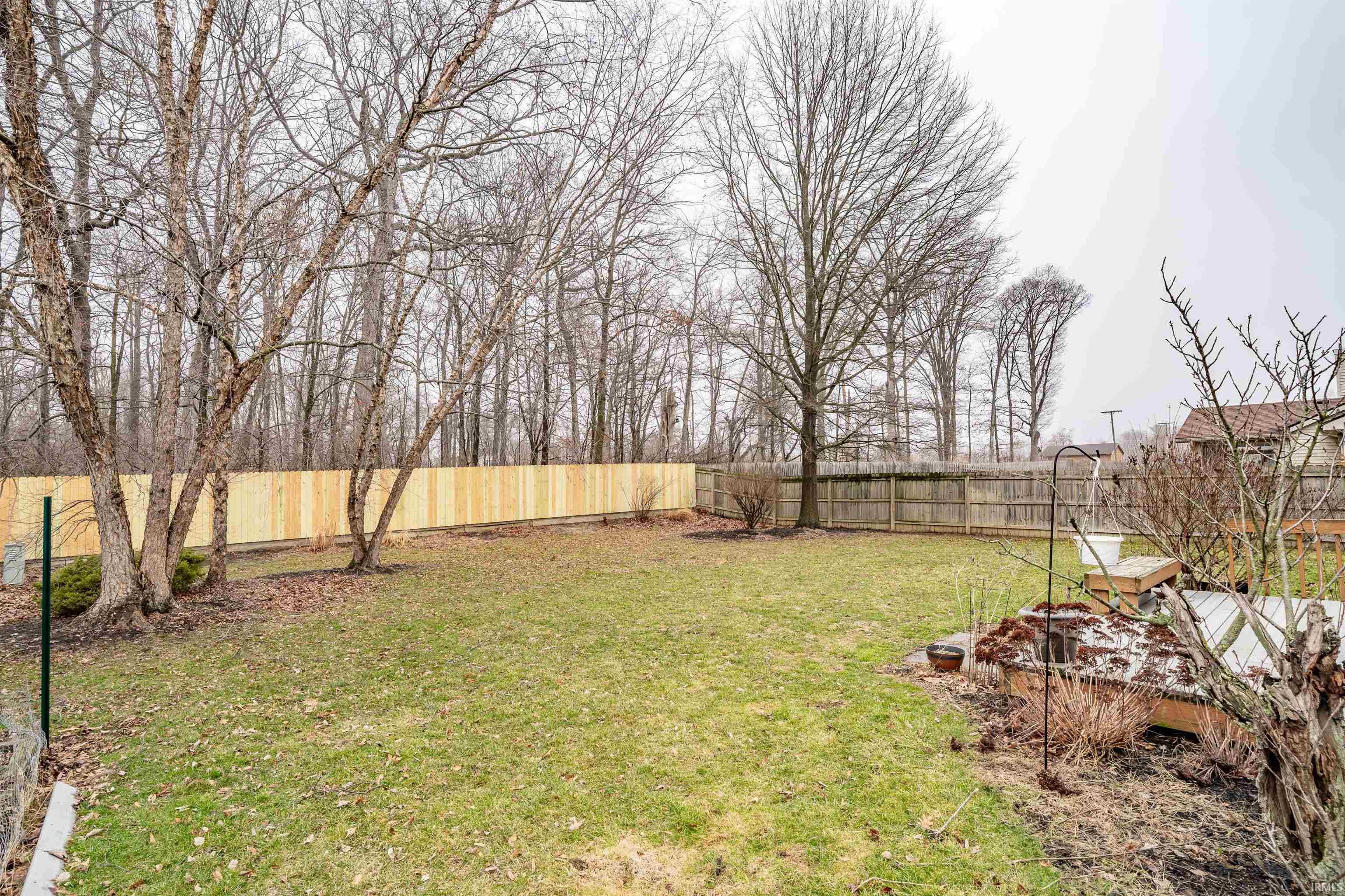 View of fenced backyard