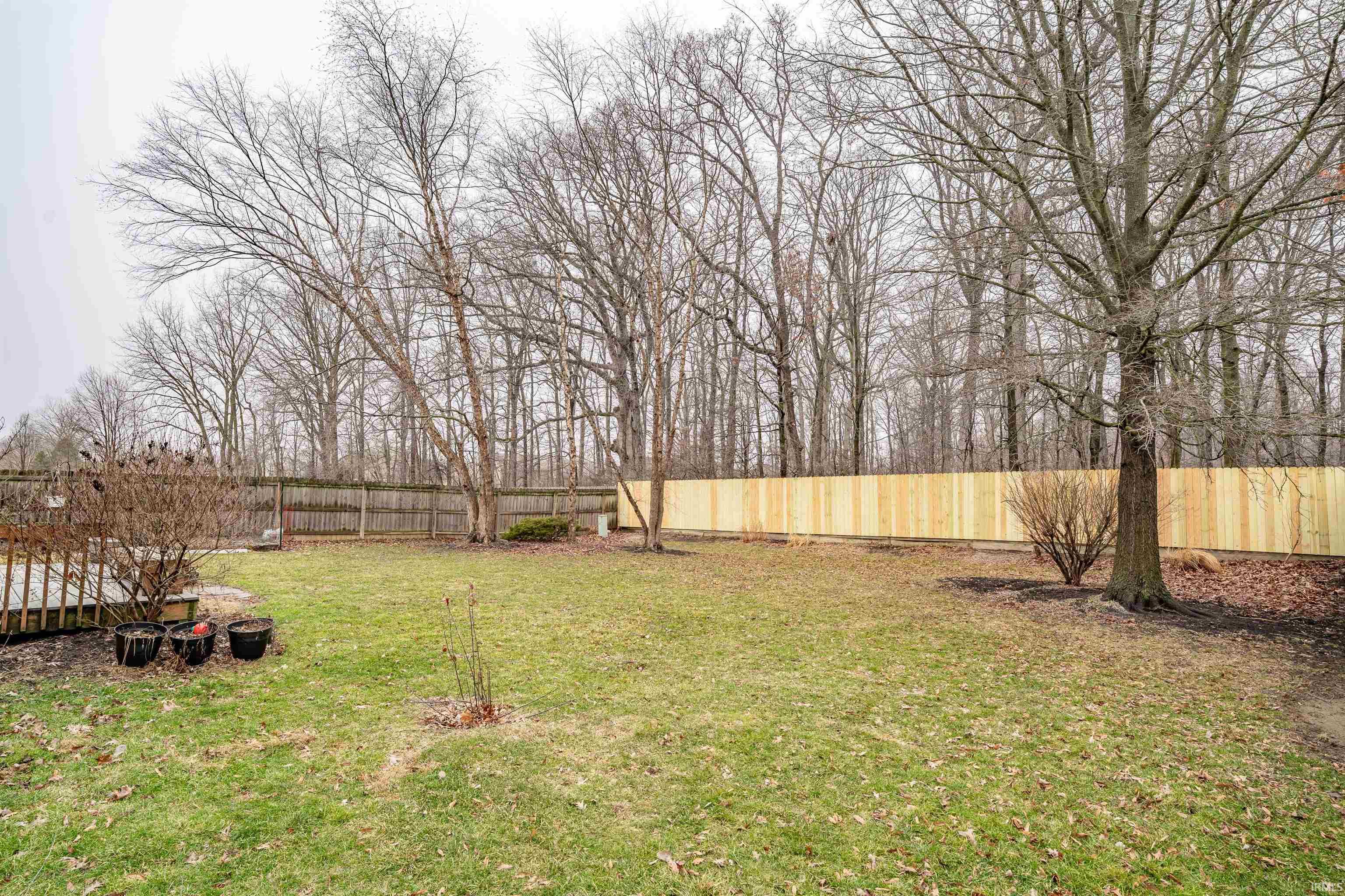 View of fenced backyard