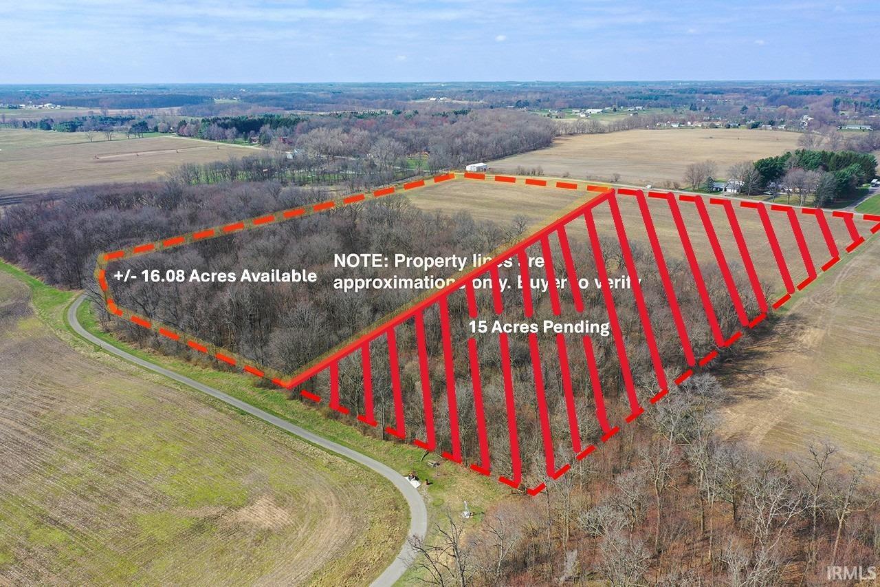 Aerial view of sparsely populated area featuring property boundaries highlighted