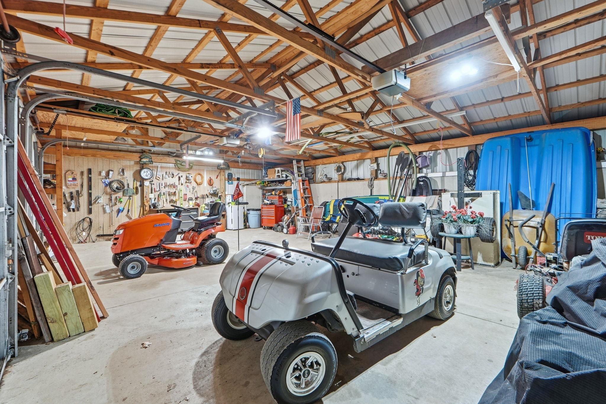 Garage with a garage door opener and a workshop area