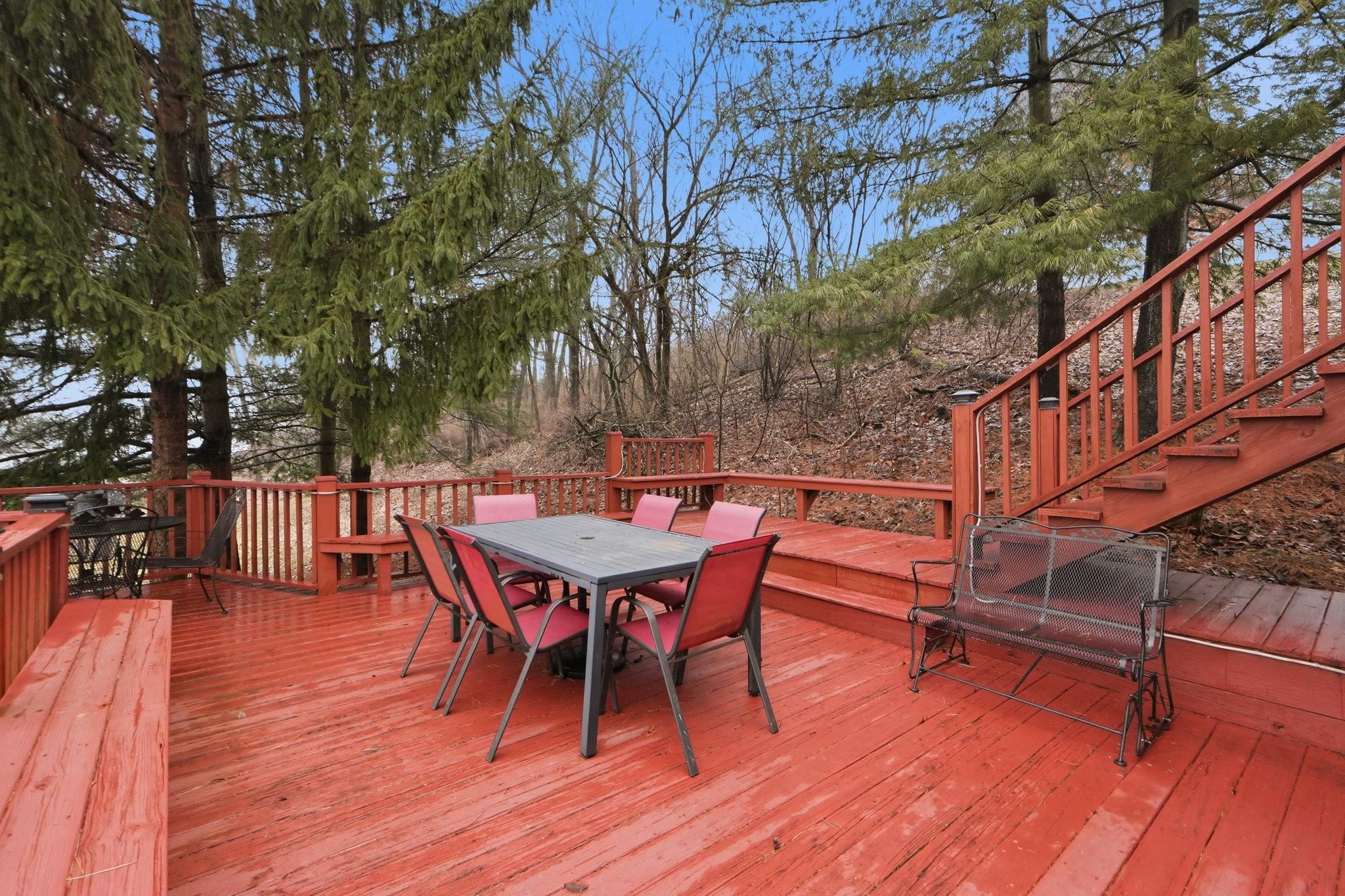 Deck with outdoor dining space and stairs
