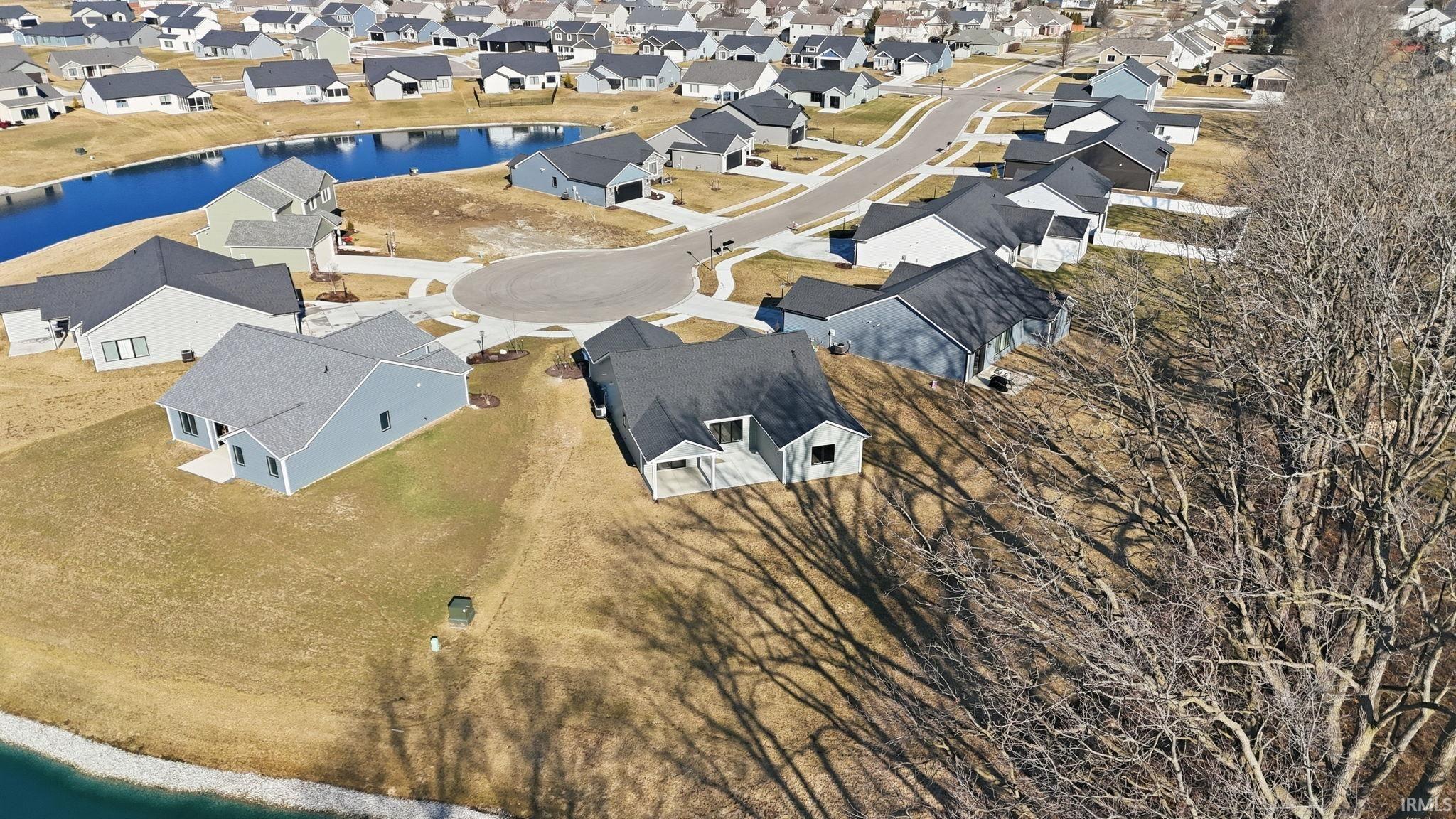 Aerial view of residential area with a nearby body of water
