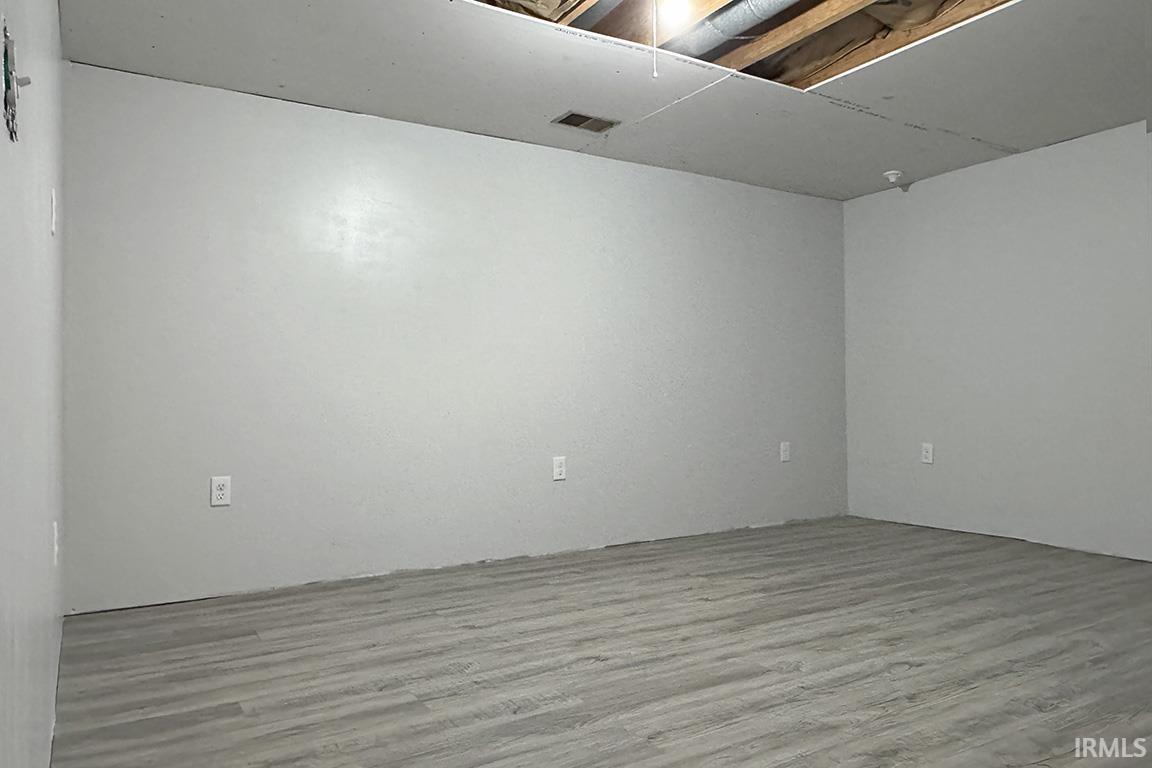 Unfurnished room featuring wood finished floors