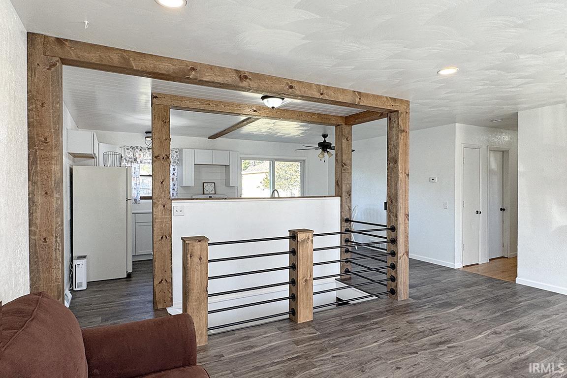 Interior space with wood finished floors and a ceiling fan