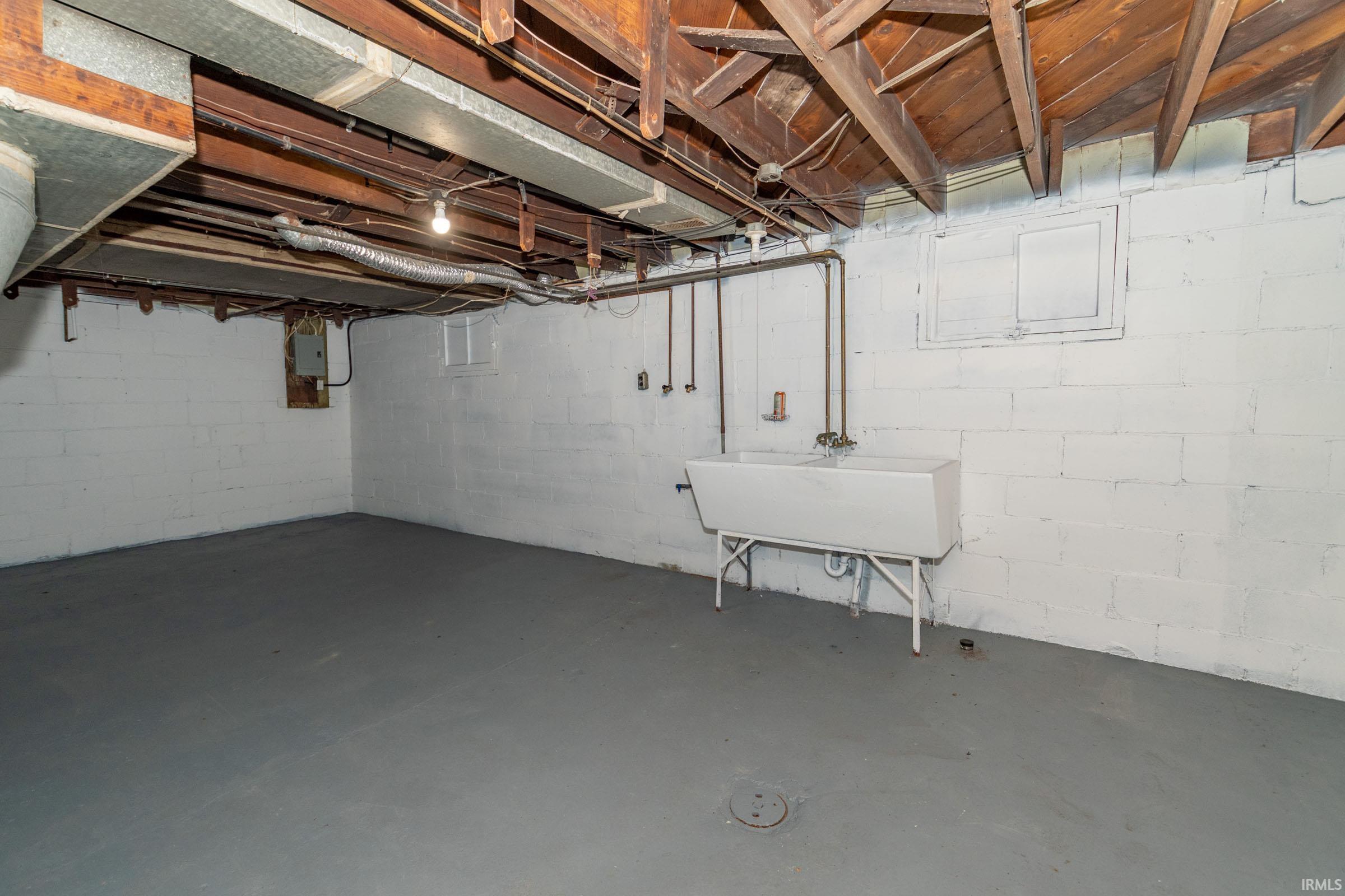 Unfinished basement featuring a sink