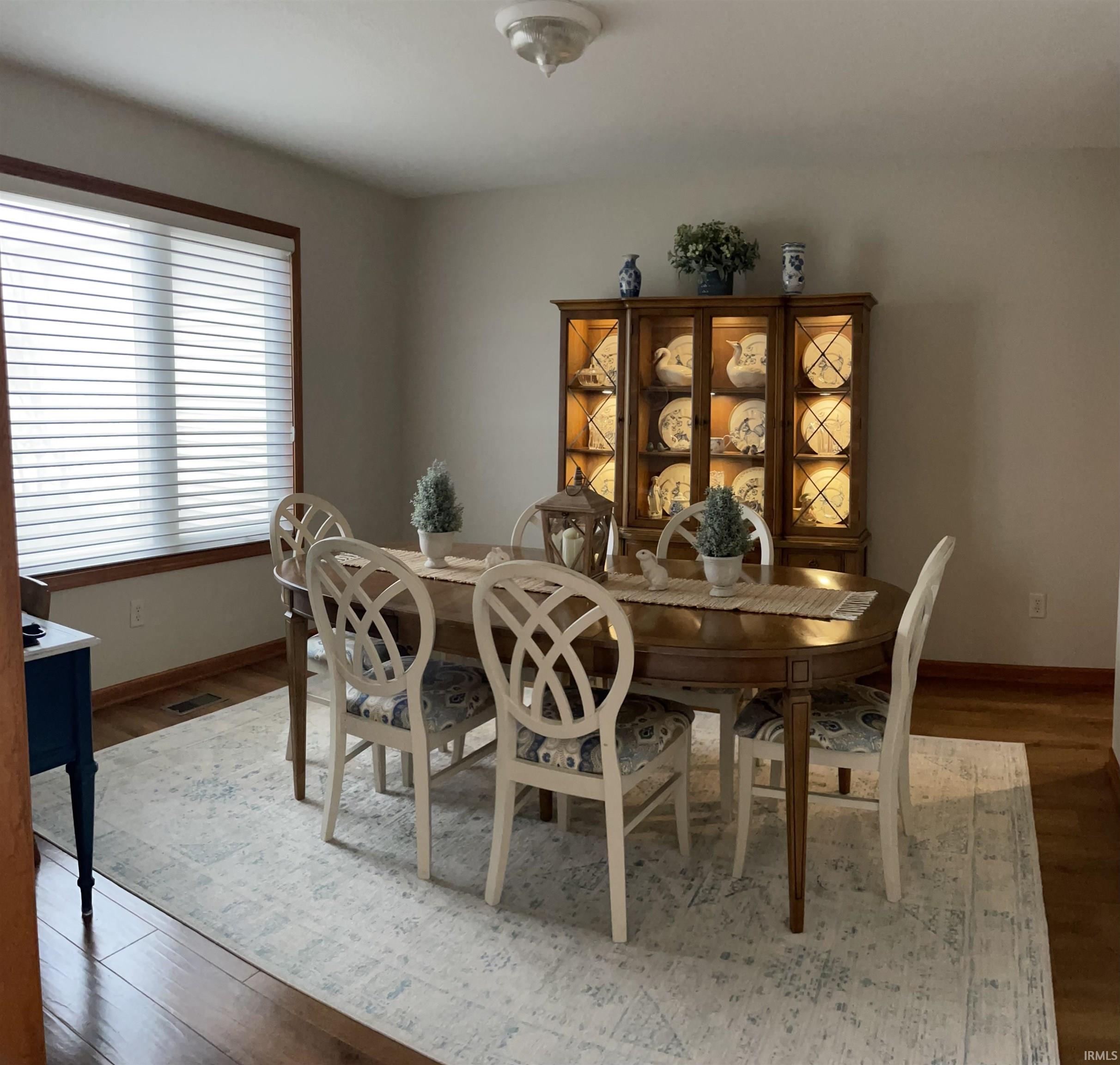 Dining area with wood finished floors