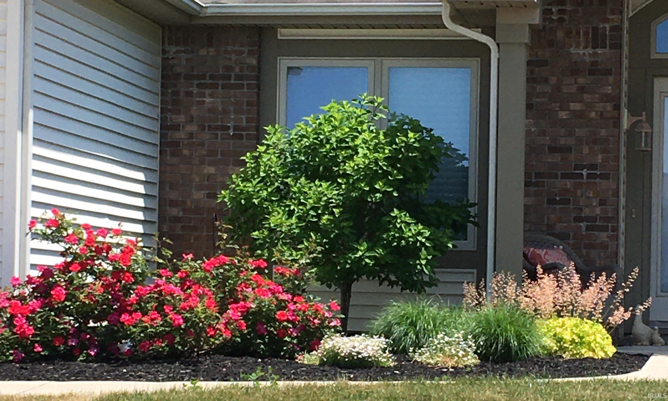 Entrance to property with brick siding
