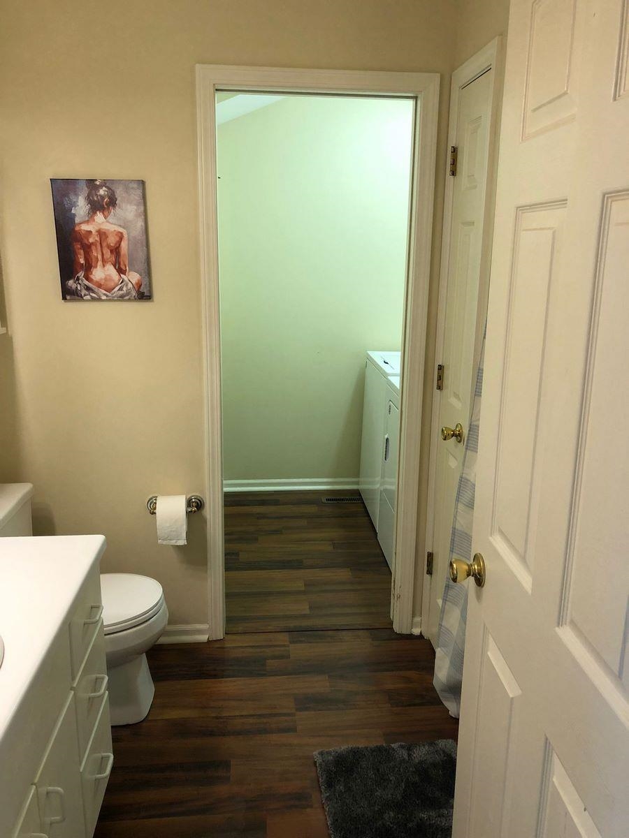 Bathroom with vanity and dark wood finished floors
