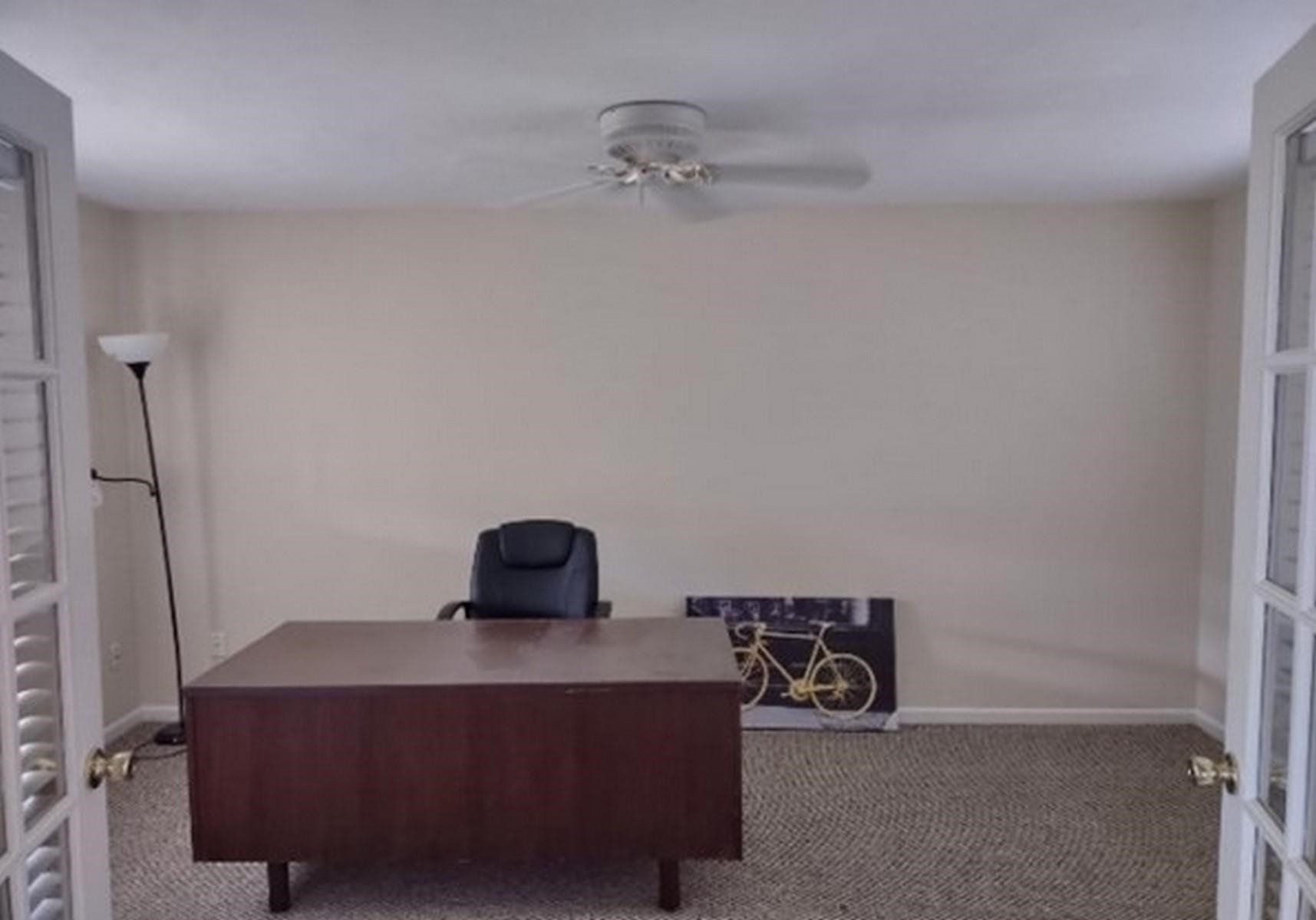 Bedroom / Home office with carpet flooring, french doors, and a ceiling fan