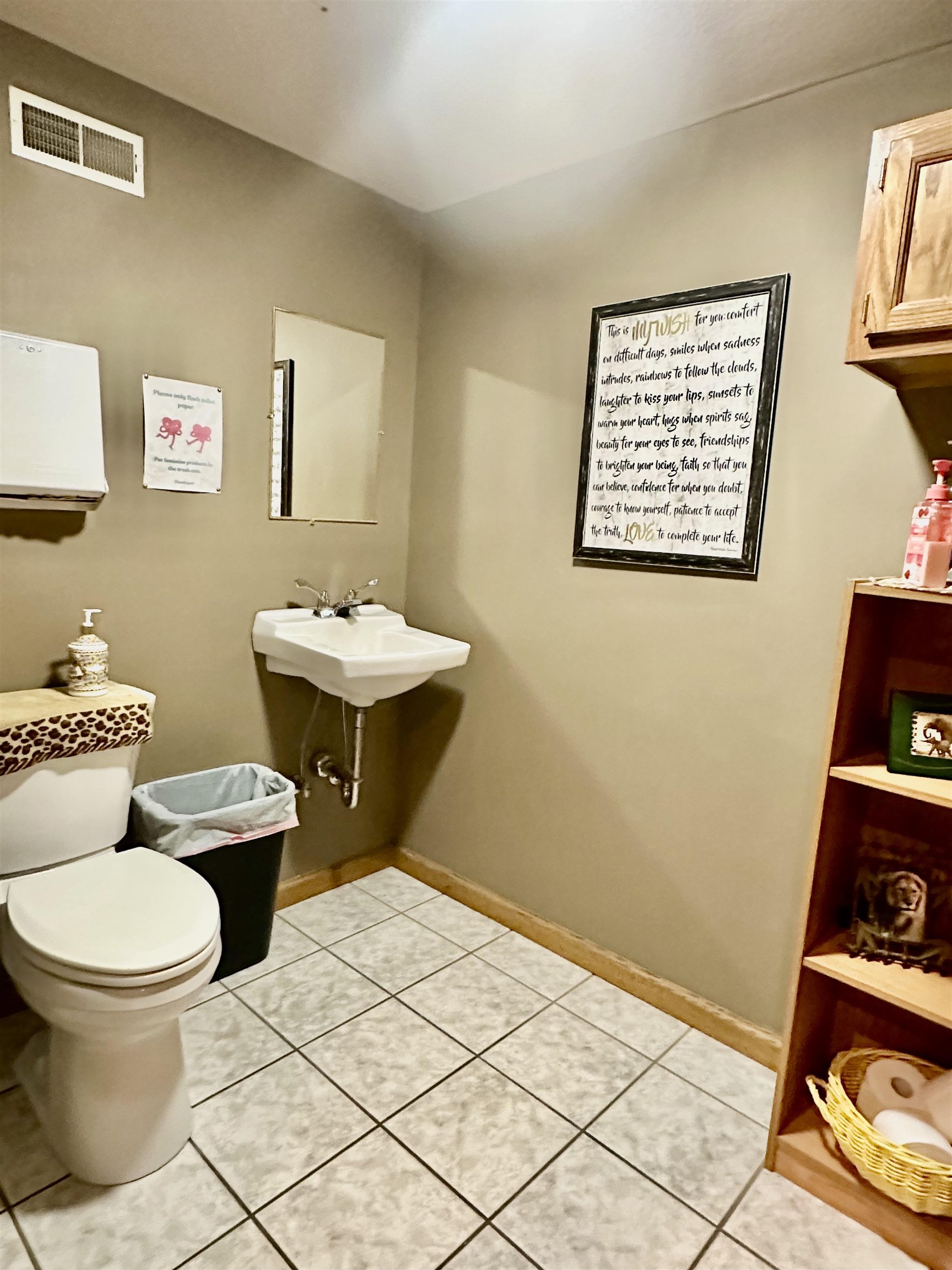 Bathroom with light tile patterned floors