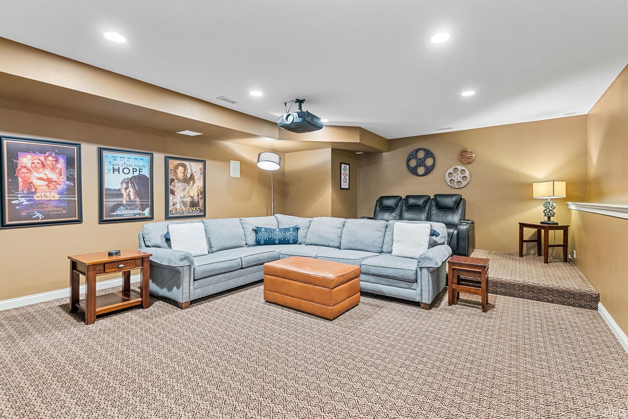 Carpeted theater featuring baseboards and recessed lighting
