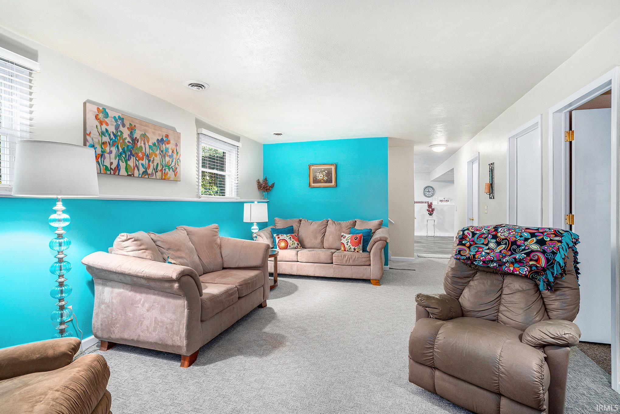 Living area featuring carpet flooring