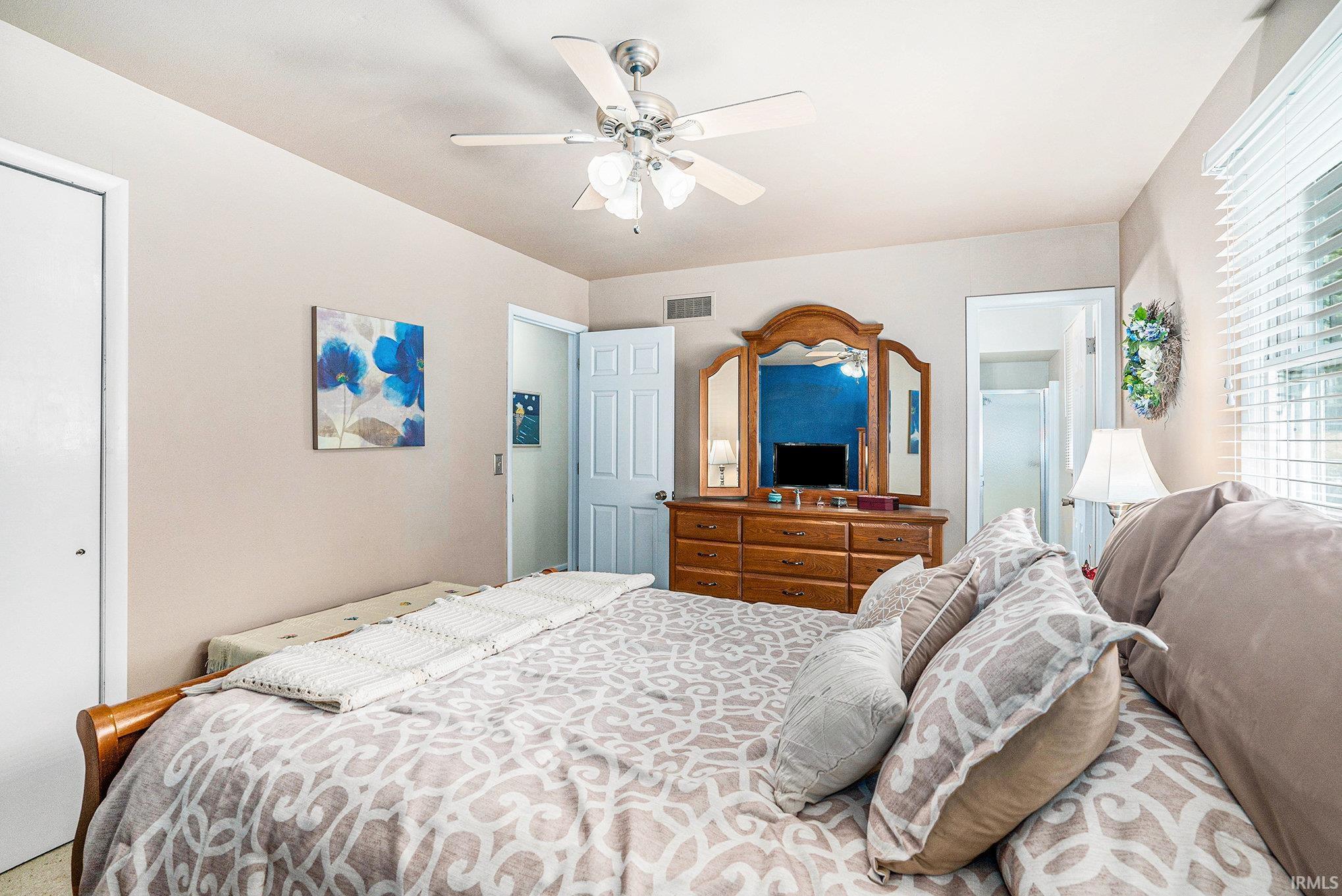 Bedroom featuring a closet and ceiling fan