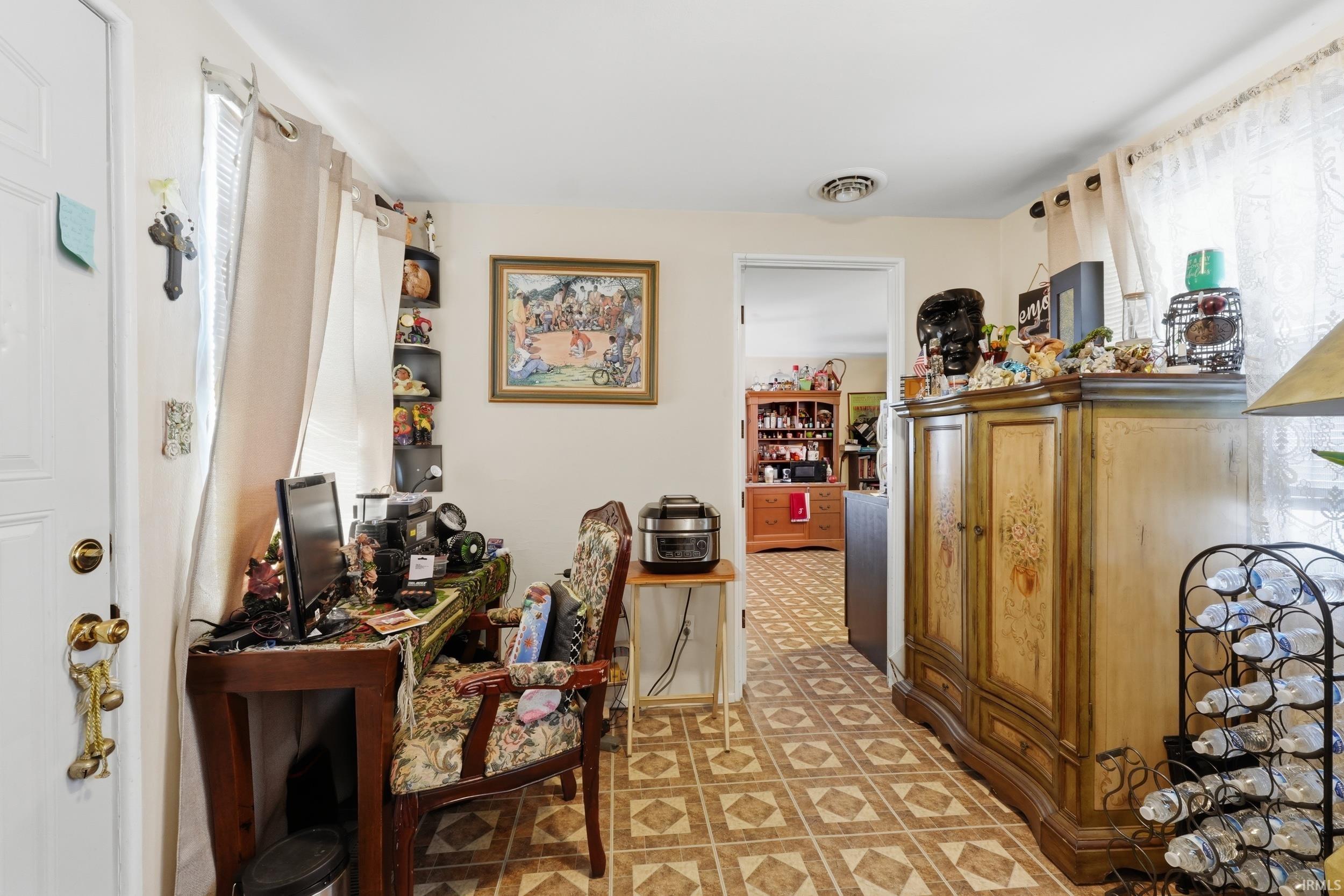 Home office featuring light flooring