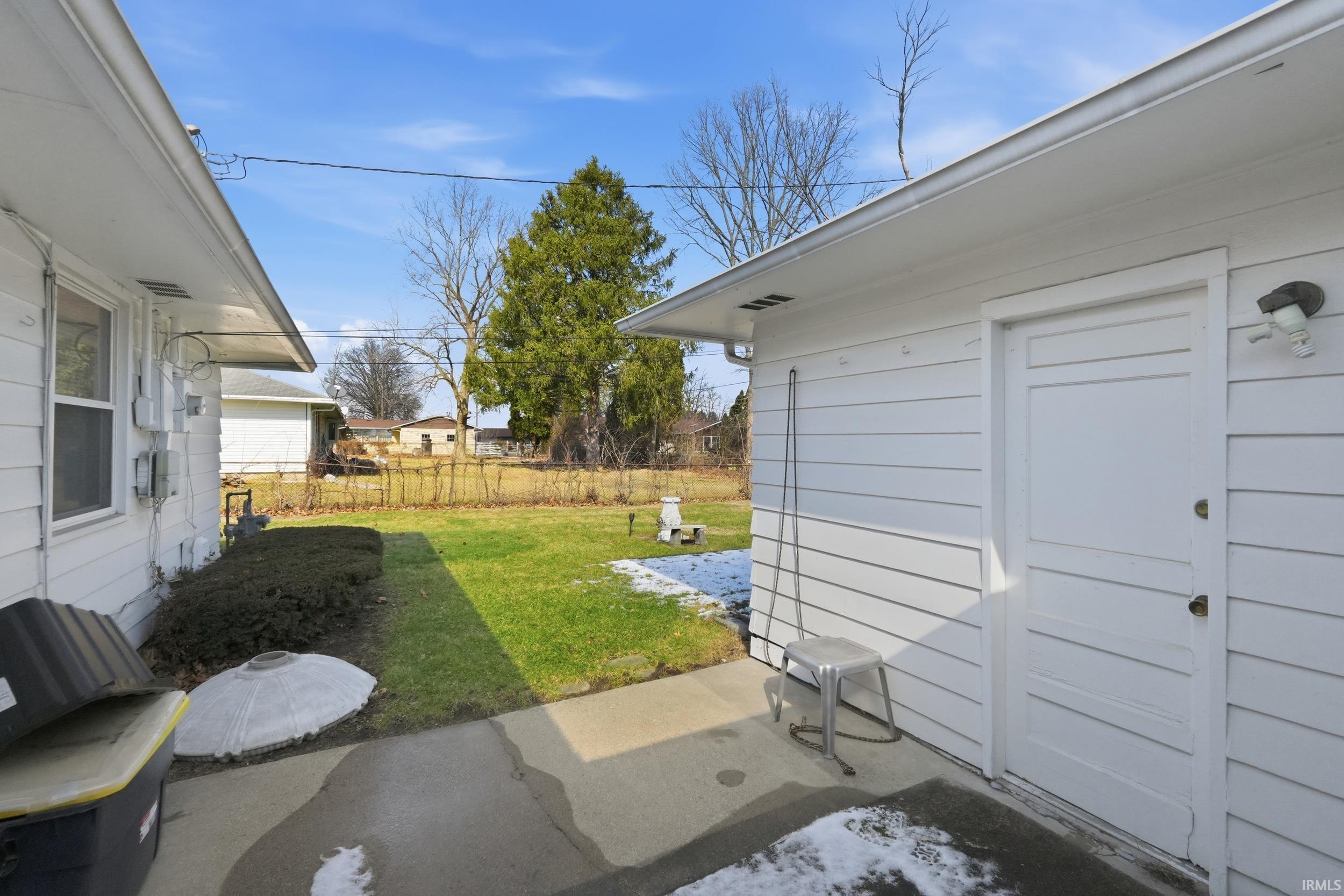 View of yard with a patio area and an outbuilding