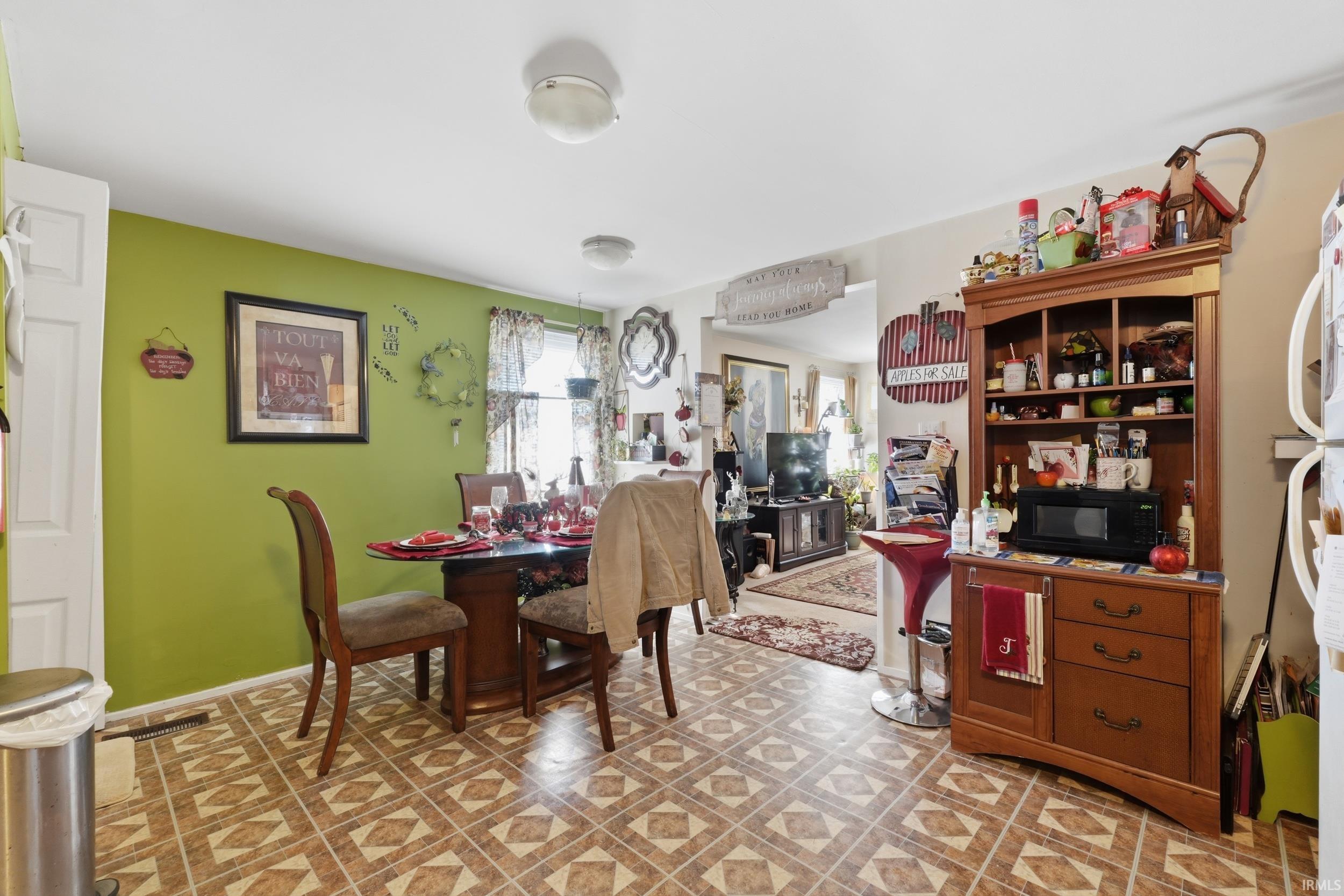 Dining area with light floors and baseboards