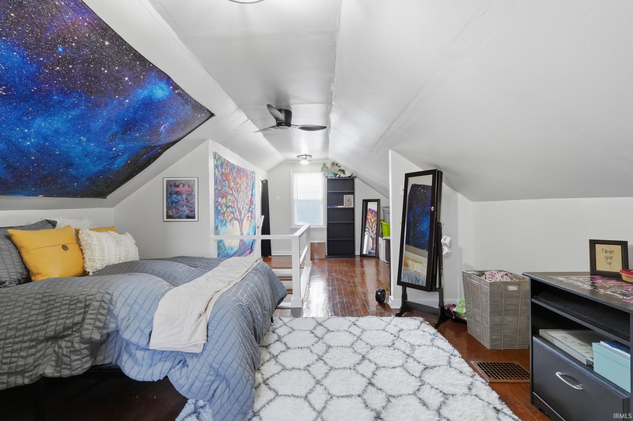 Bedroom featuring dark wood-style flooring