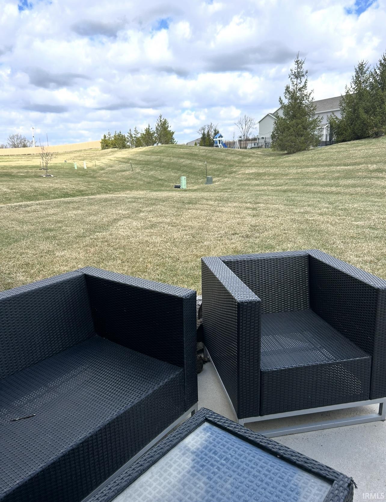View of grassy yard with a view of countryside